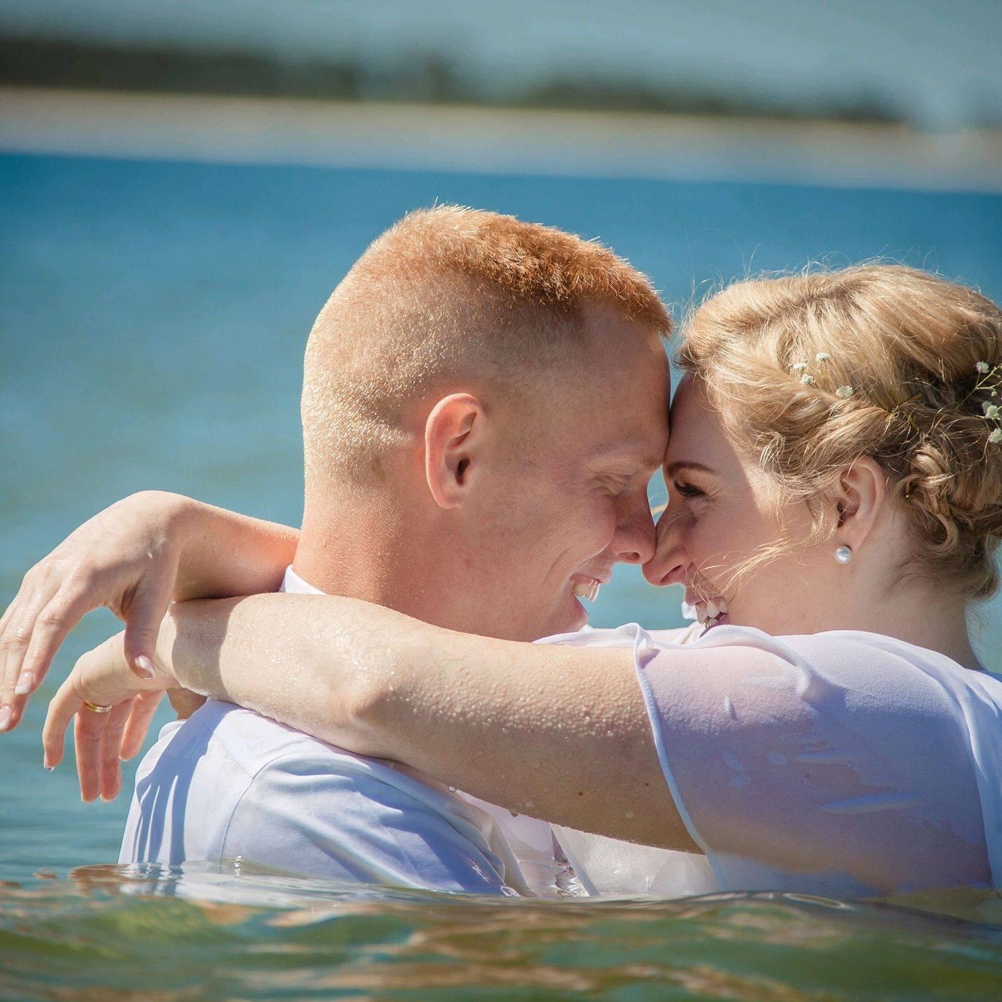 If you get married on the beach, you gotta get in the ocean. Wedding dress and all.