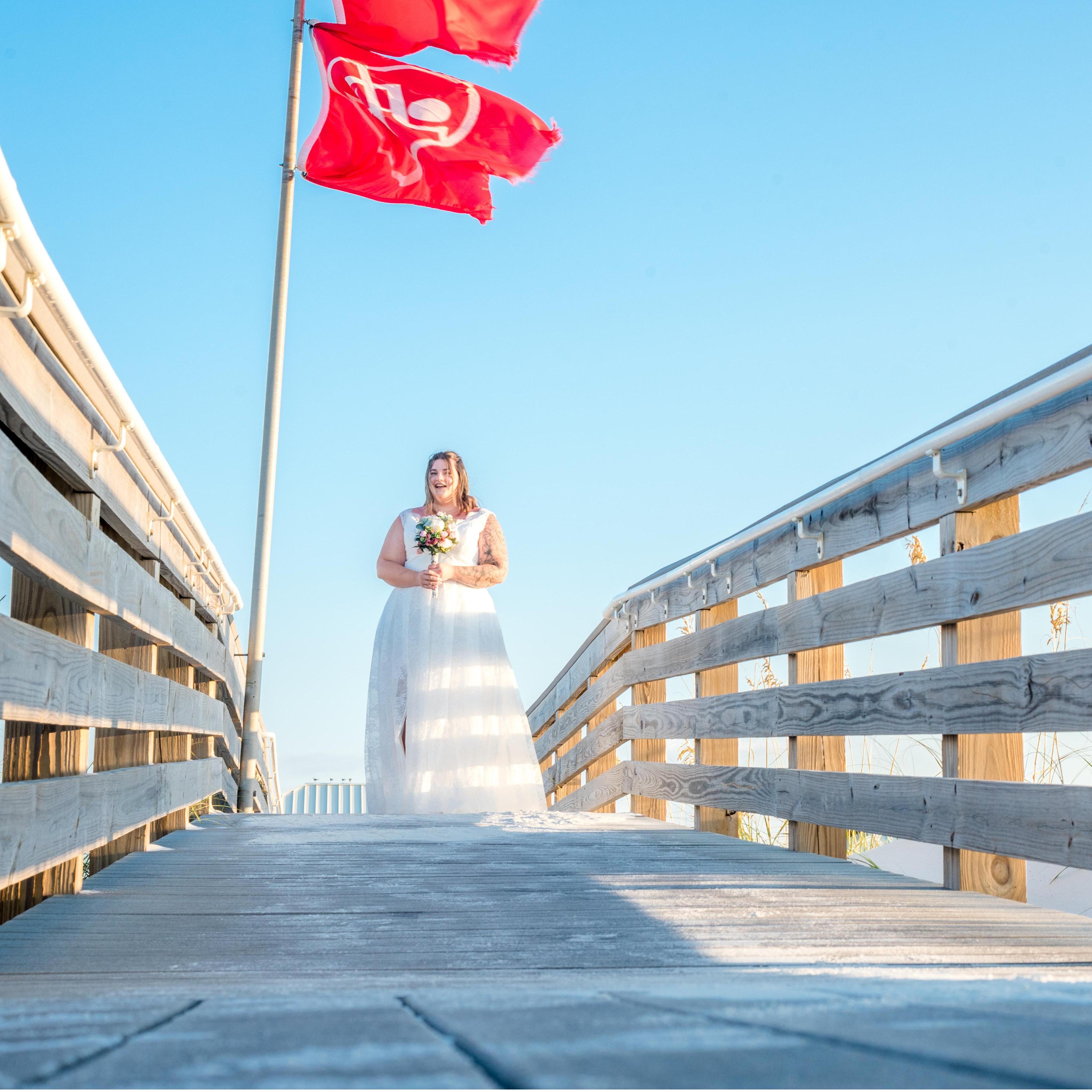 Alyssa walking down the boardwalk, excited to see her future husband.