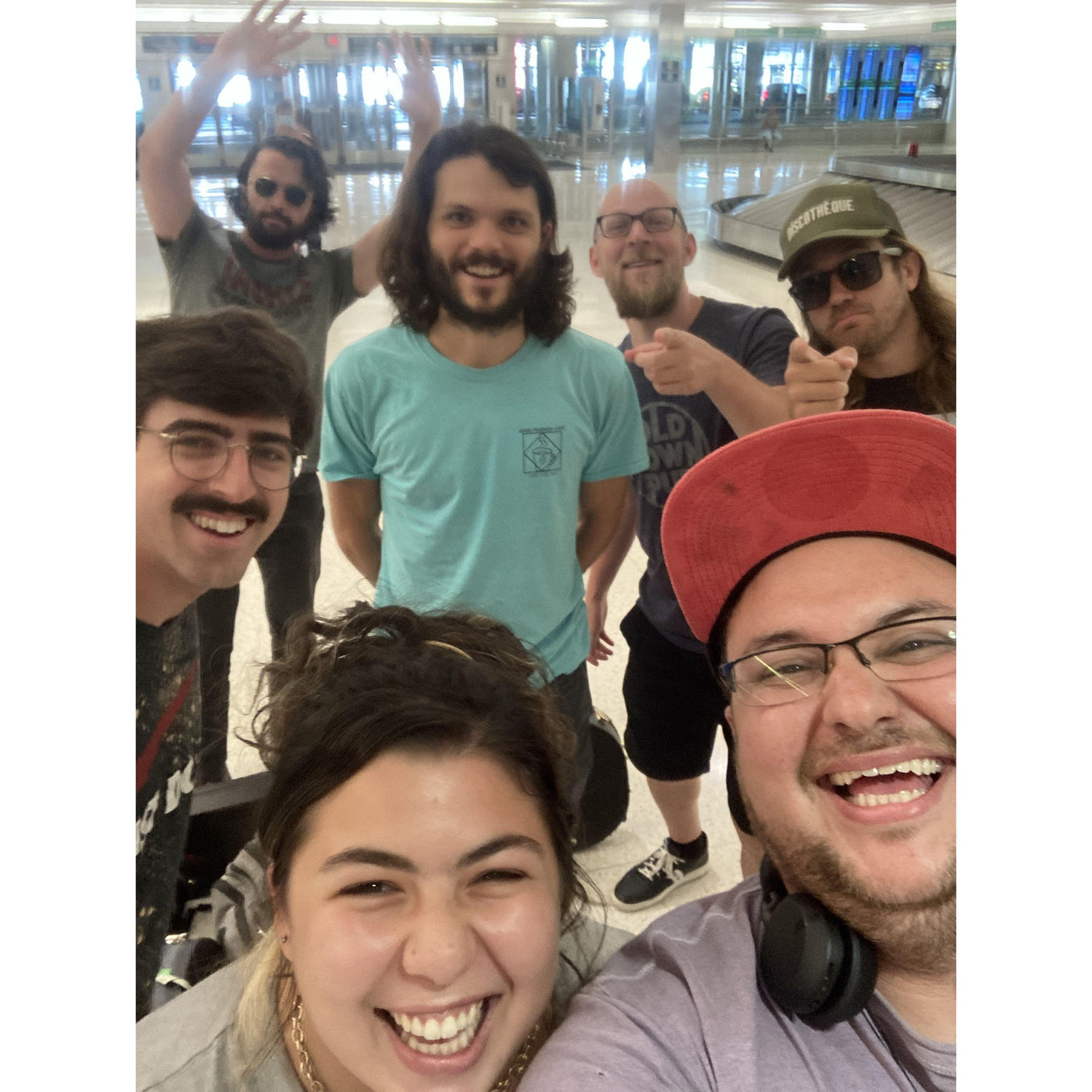 Meeting our favorite band at the baggage claim!