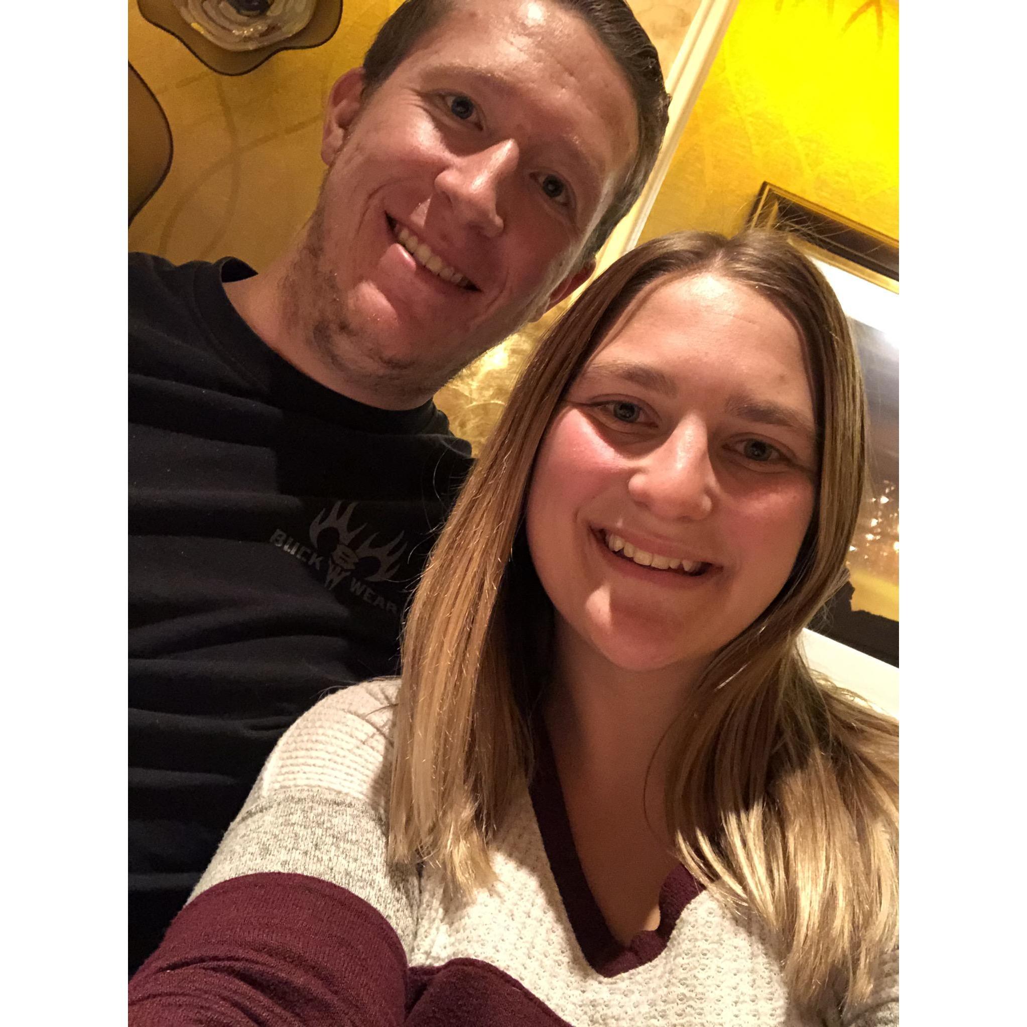 Celebrating our engagement at dinner.