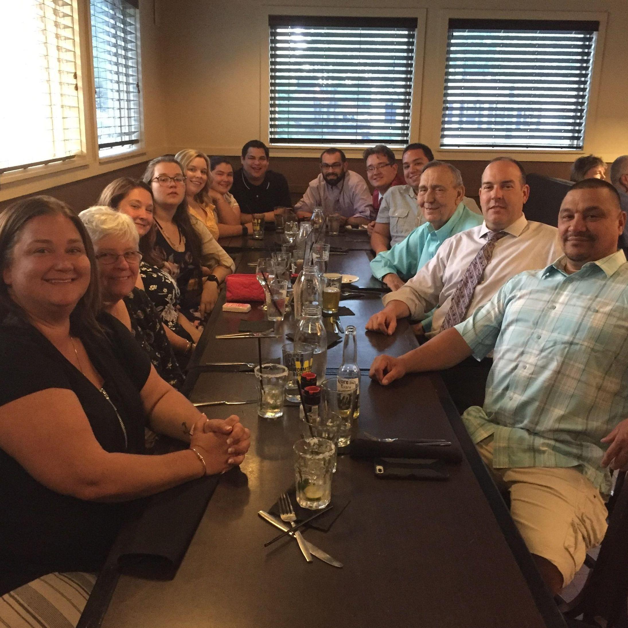 Kayla's family at dinner celebrating Kevin's high school graduation