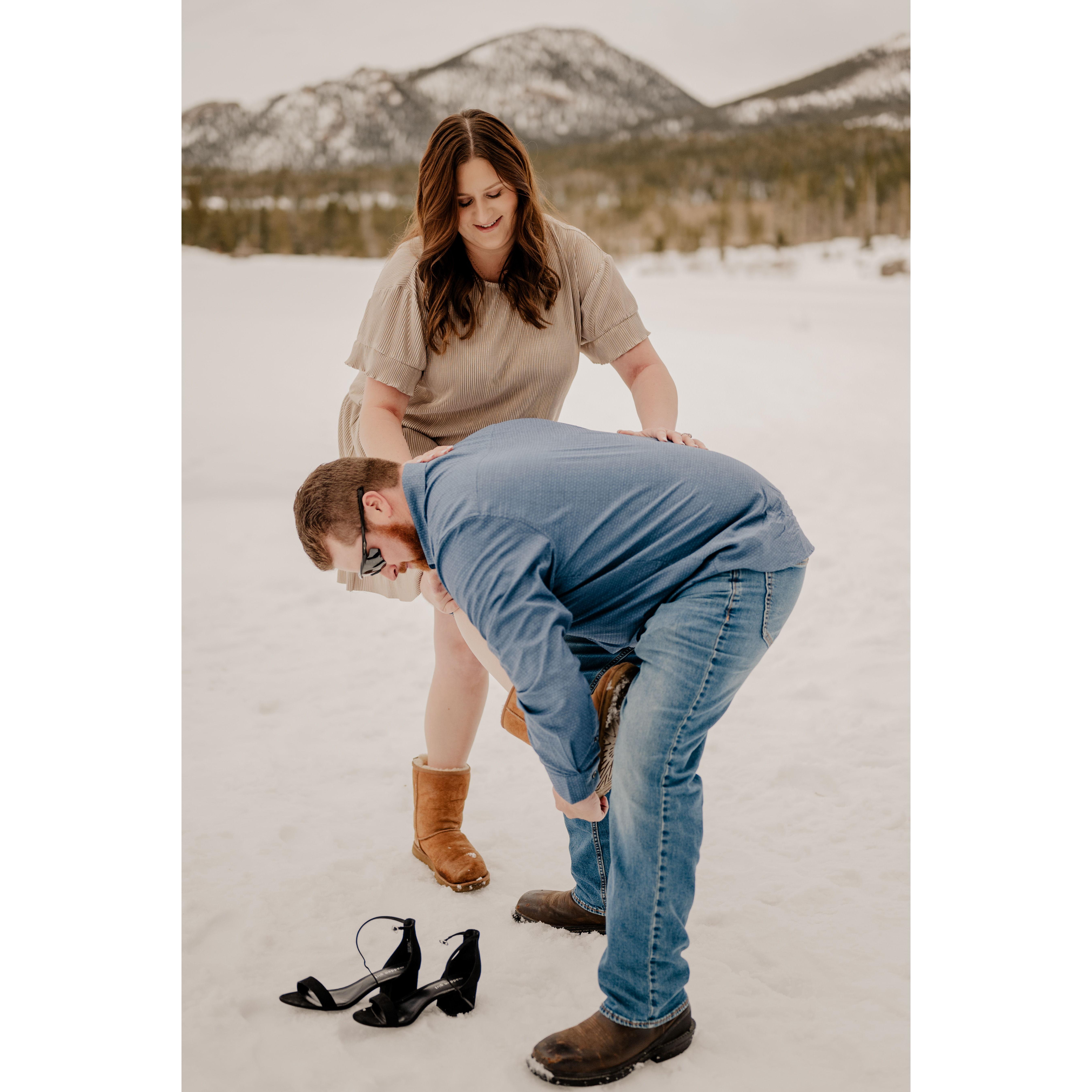 Amy was not walking in snow with heels on so between spots and locations during the shoot, Amy would wear boots to walk! Zach was there to help when the heels needed to come back on!
