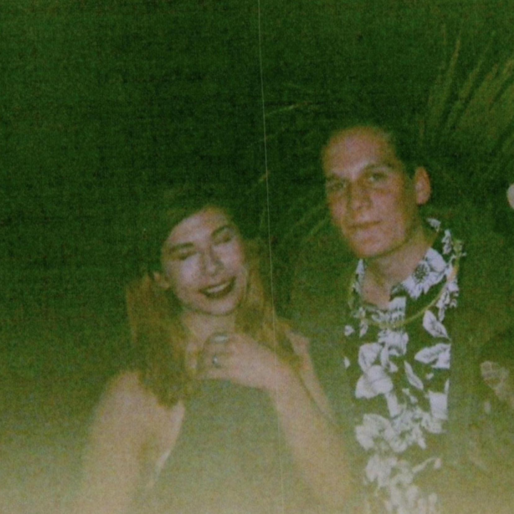 Quite possibly the first photo we've ever taken together - on an expired disposable camera, at Tyler's 23rd Shrek themed birthday party.