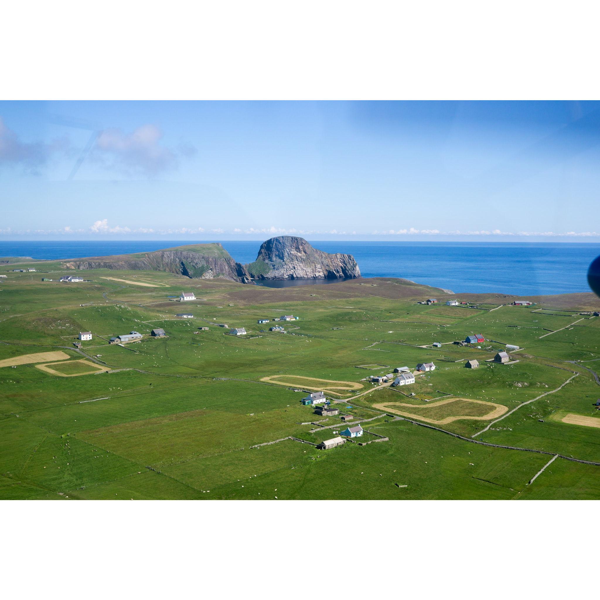 Aerial view of the south of the Fair Isle where most of the residents live.