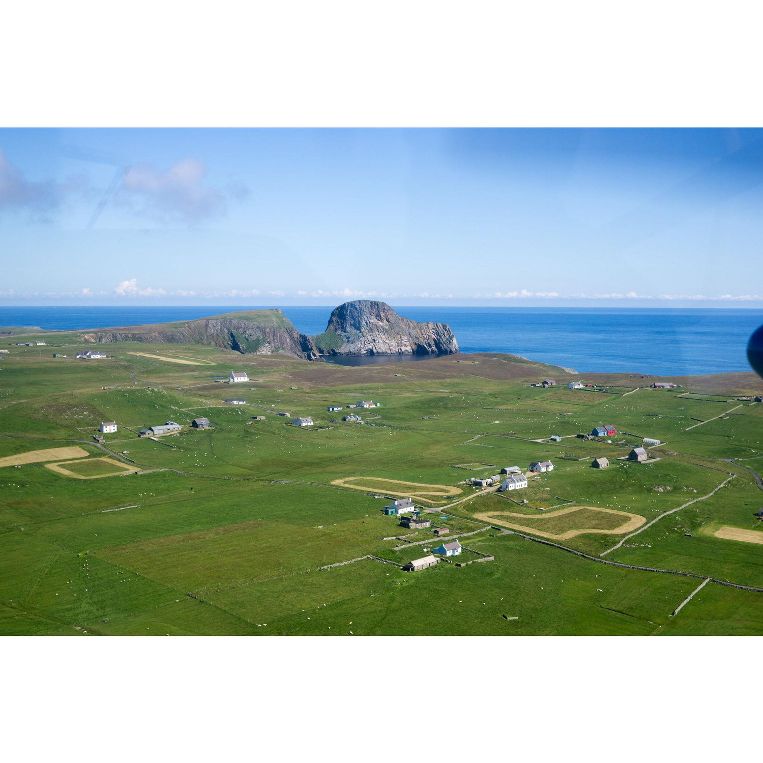 Aerial view of the south of the Fair Isle where most of the residents live.