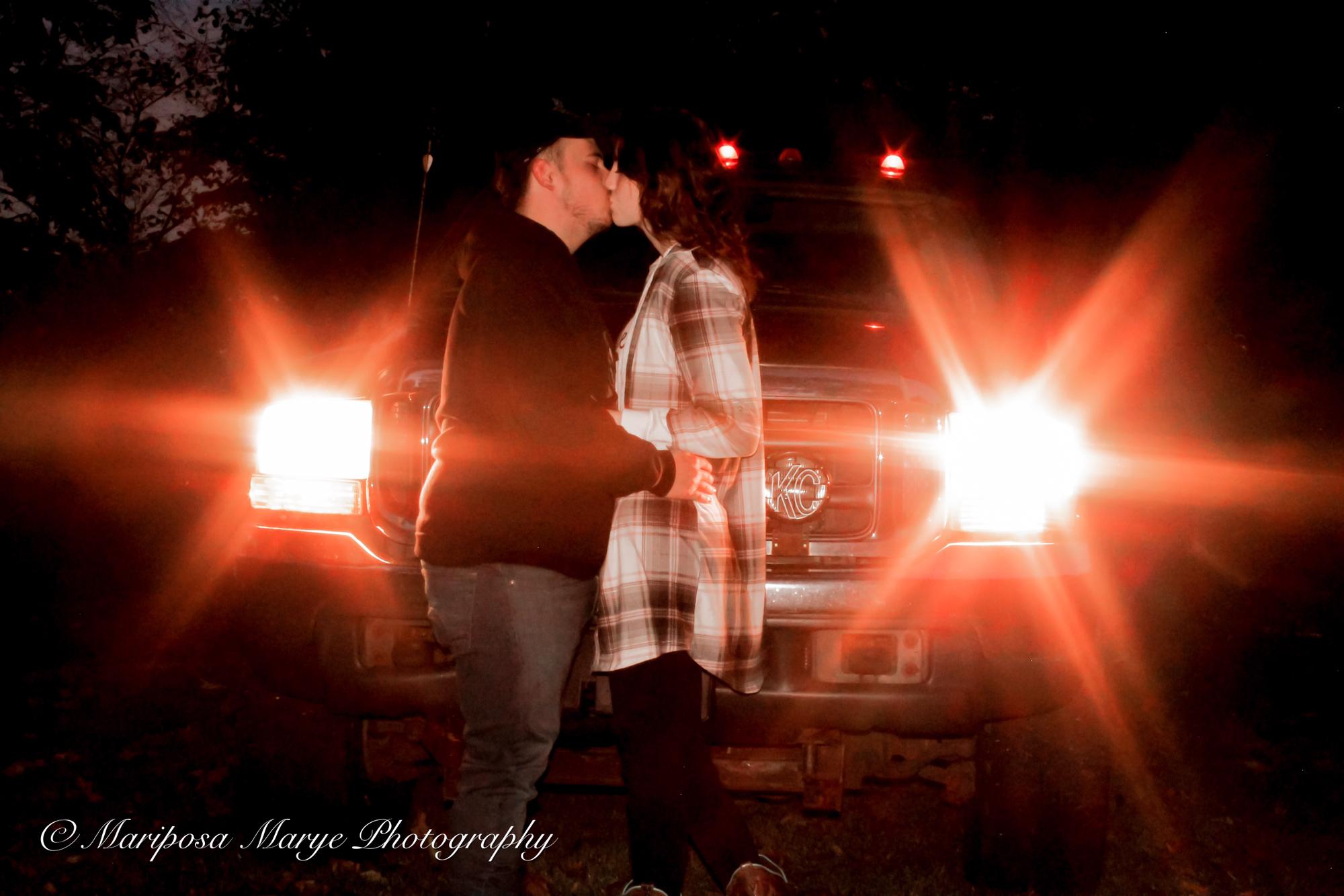 The bride, groom, and his truck.