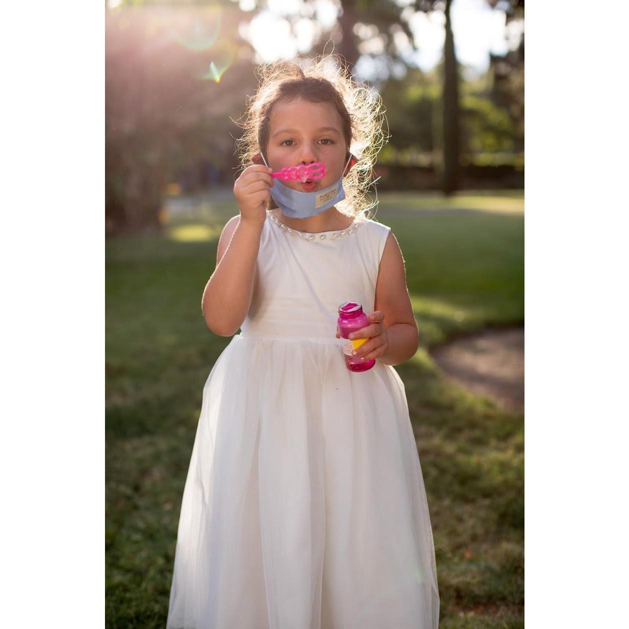 Rachel's niece, Sofia, celebrating with bubbles