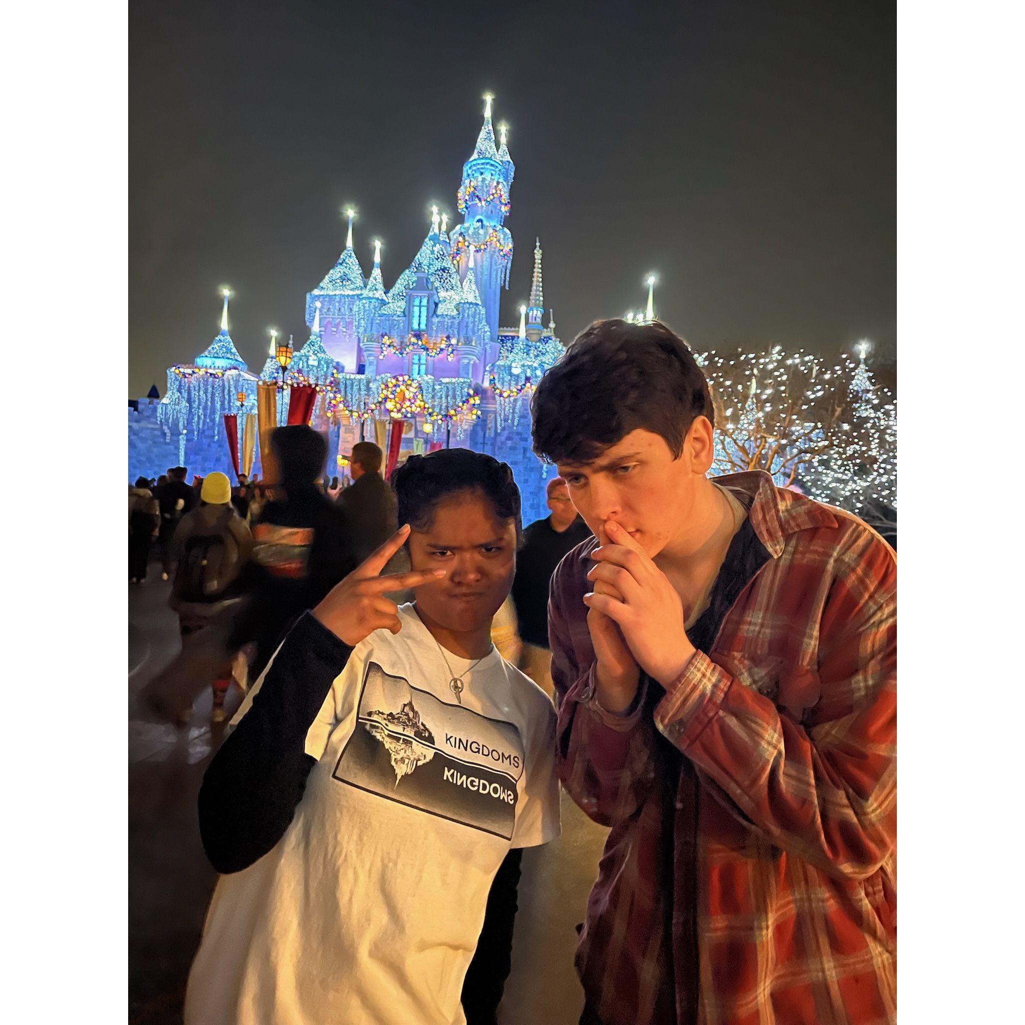(December 19, 2022):  The interns went to disneyland!! Joysinet got photos with every intern in front of the castle. You can't tell, but they're both nervous to be this close to each other.