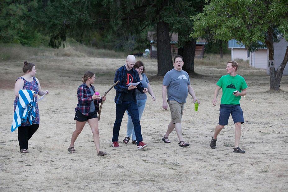 Anna and Ryan competing in a scavenger hunt at a church camp retreat.