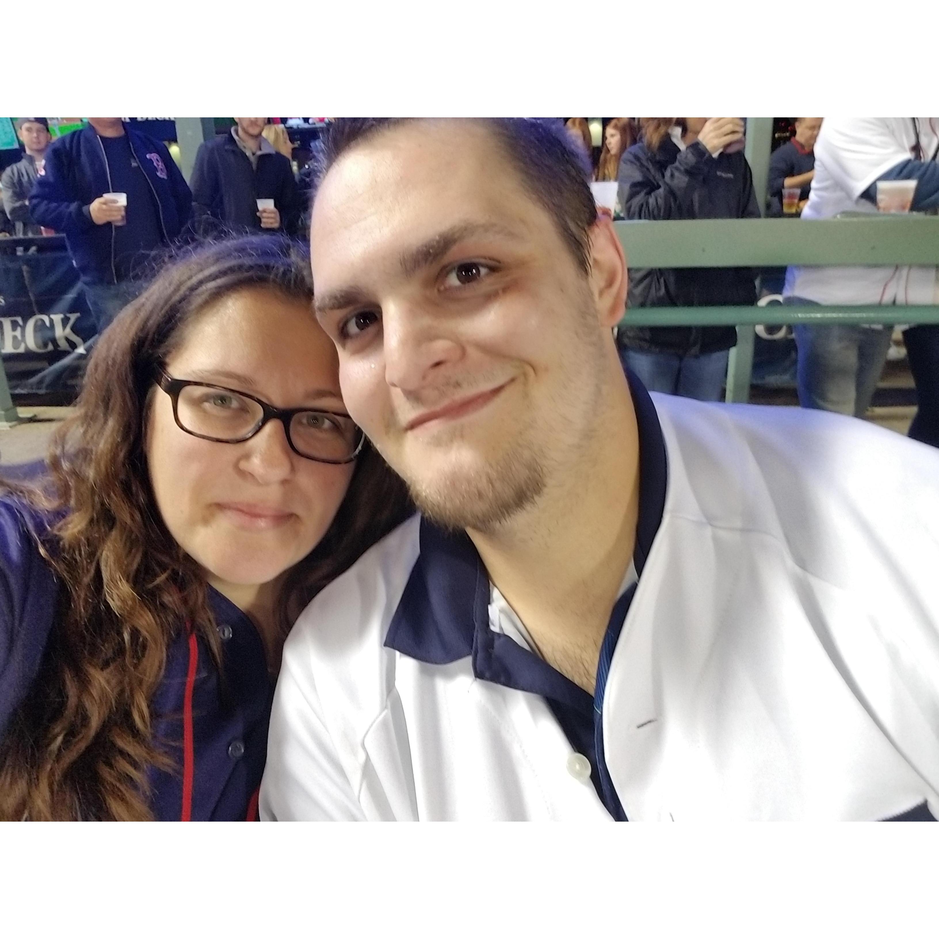 At a Red Sox / Yankee game! He love the yankees and I love the Red Sox!!!!