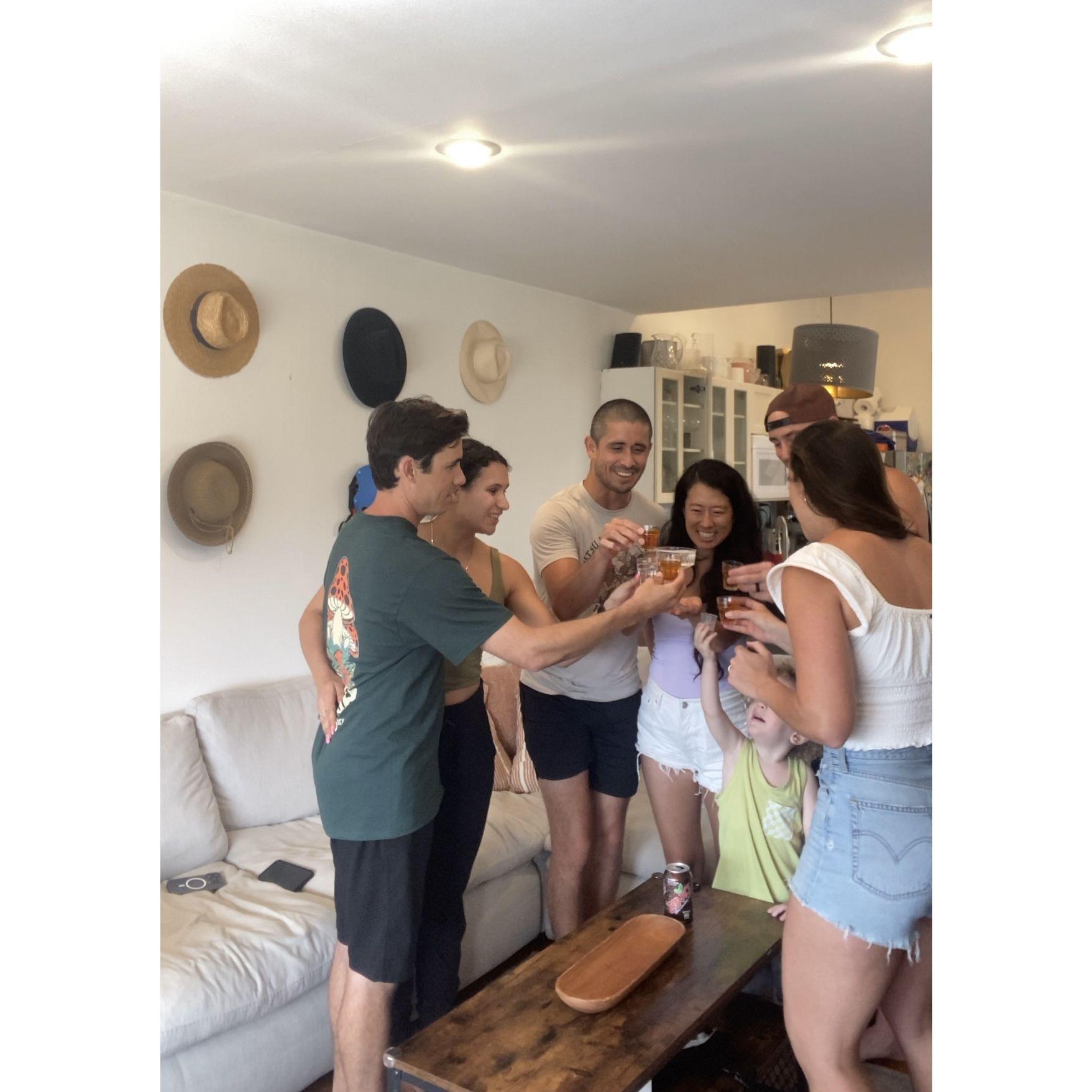 Cheers'ing in the Barriga's baby announcement (water shot for Jennie)