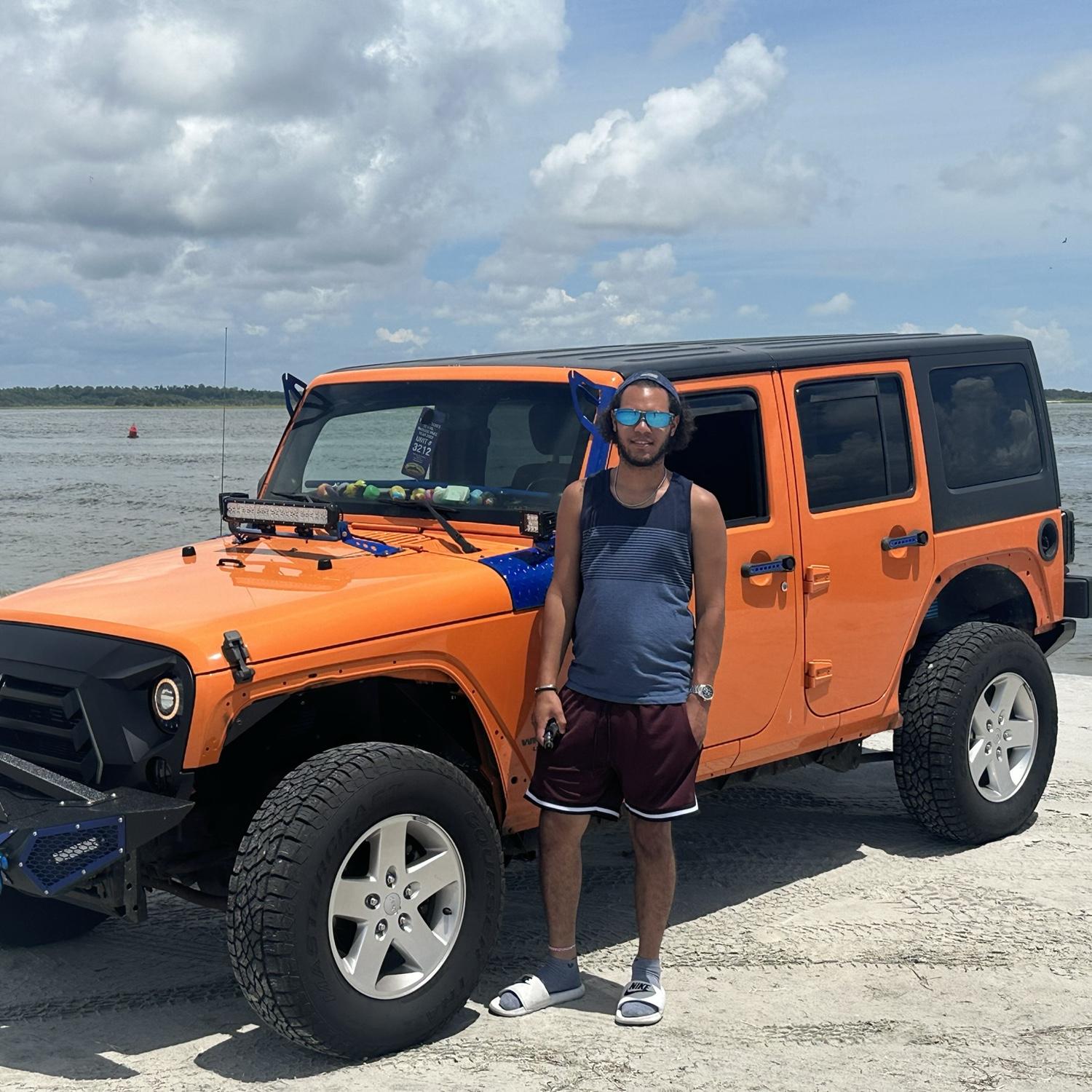 His first time driving on the beach during our first vacation together!