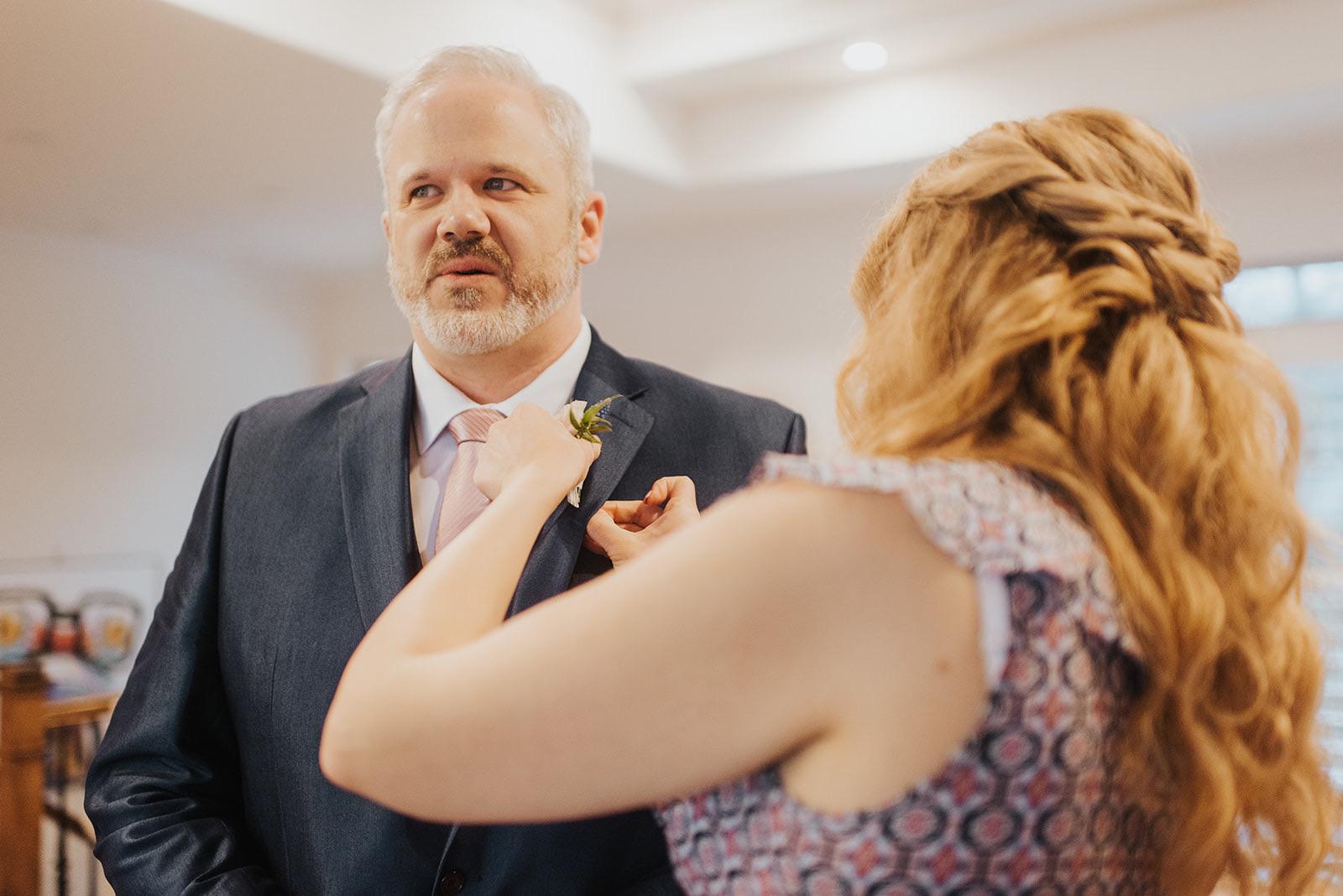 Jaece’s sister, Kaitlin, helping with the boutonnière