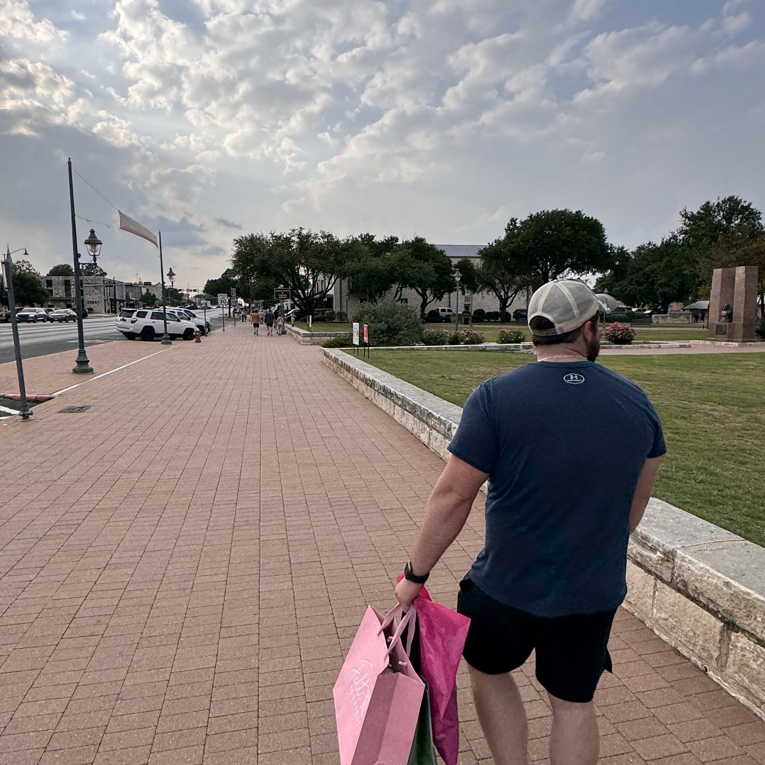Jordan taking Lari shopping and carrying her bags