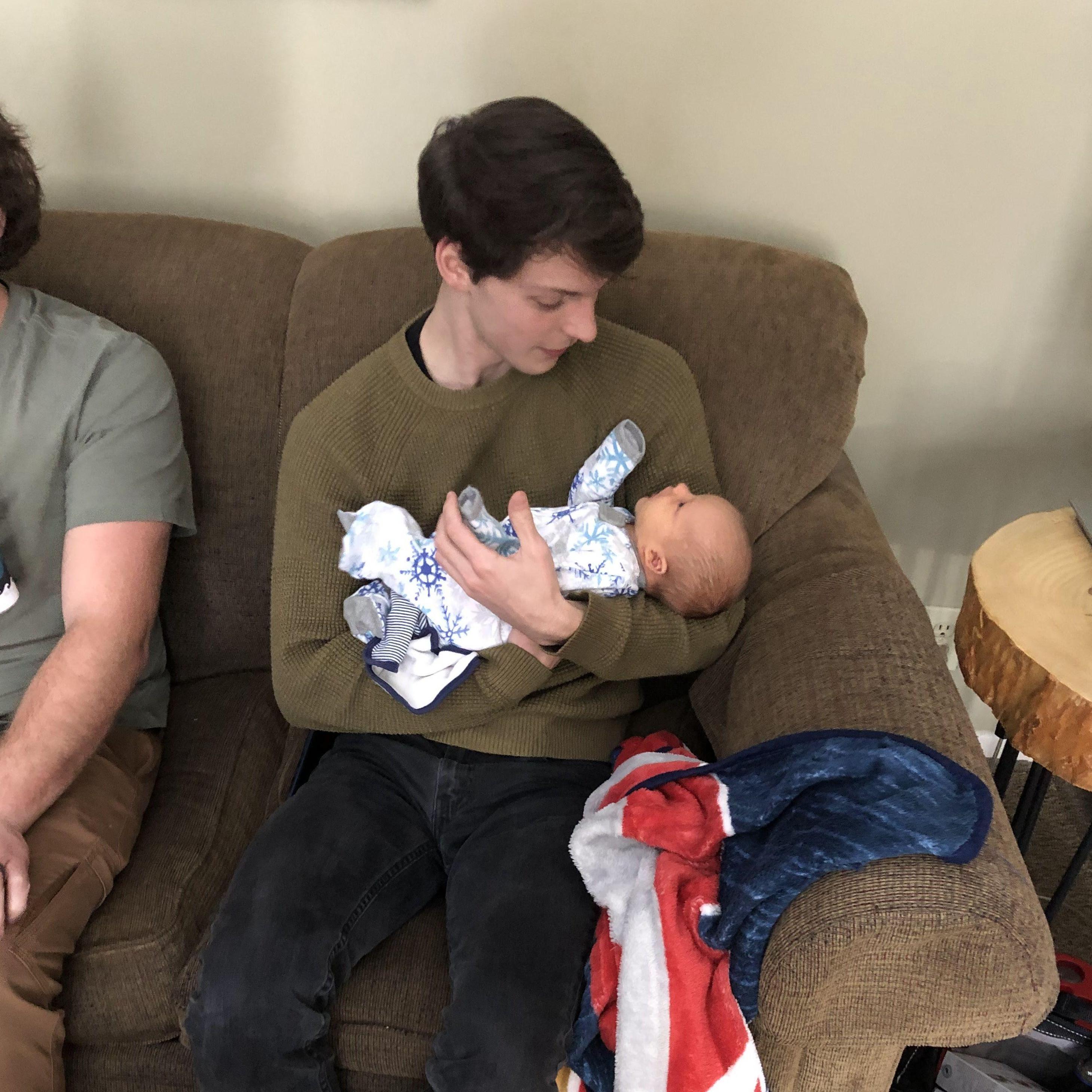 Derrick meeting baby James, Meredith's nephew.