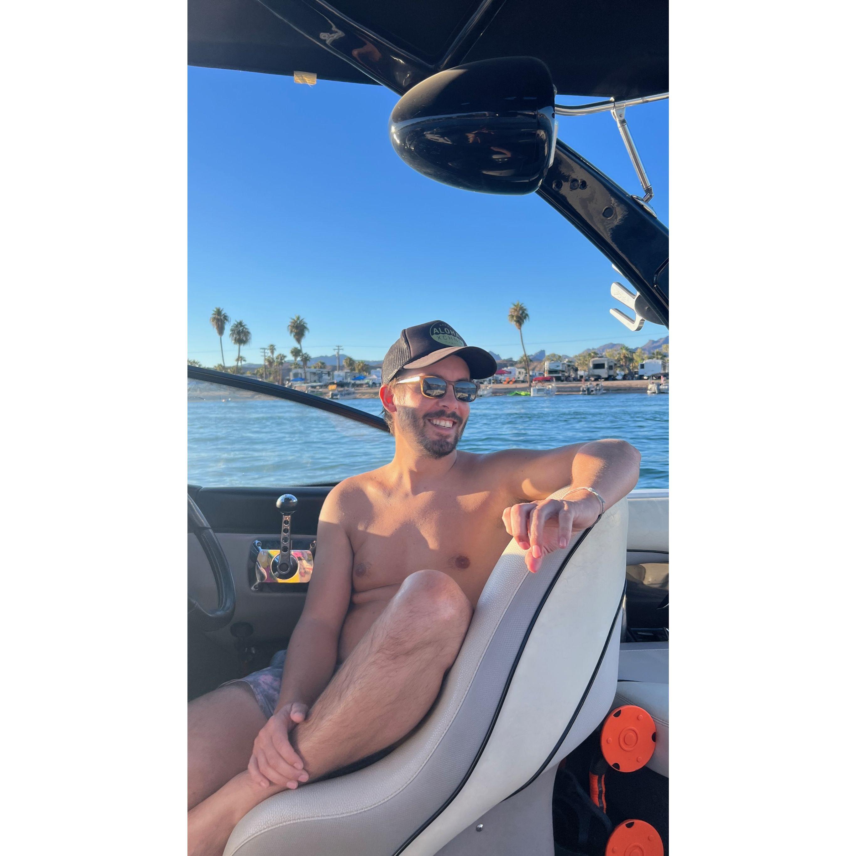 RJ happy as a clam driving the boat!