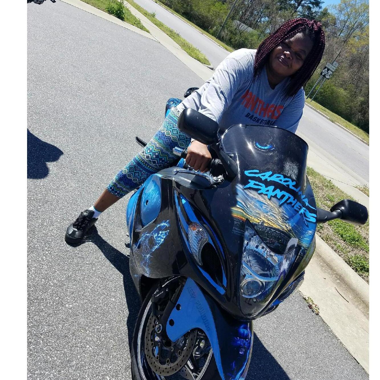 I had just finished a 5K Walk sponsored by my nieces Shae in my home town of Princeville NC.  I couldn't resist sitting on this Carolina Panther Bike.