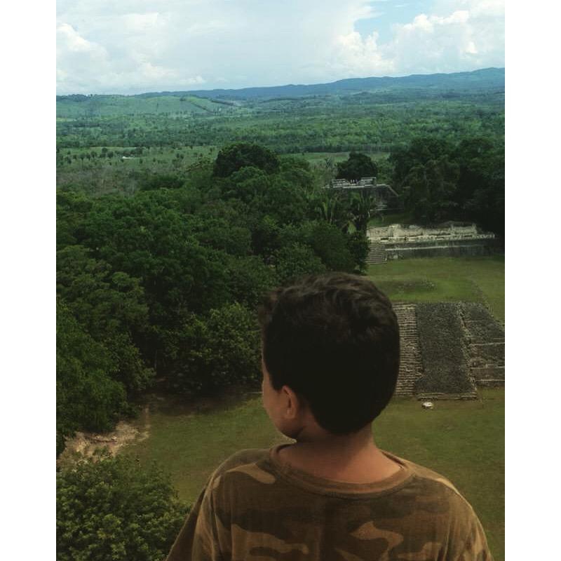 Malakhi takes in the view from the top of Belize's beautiful Mayan temple, Xunantunich