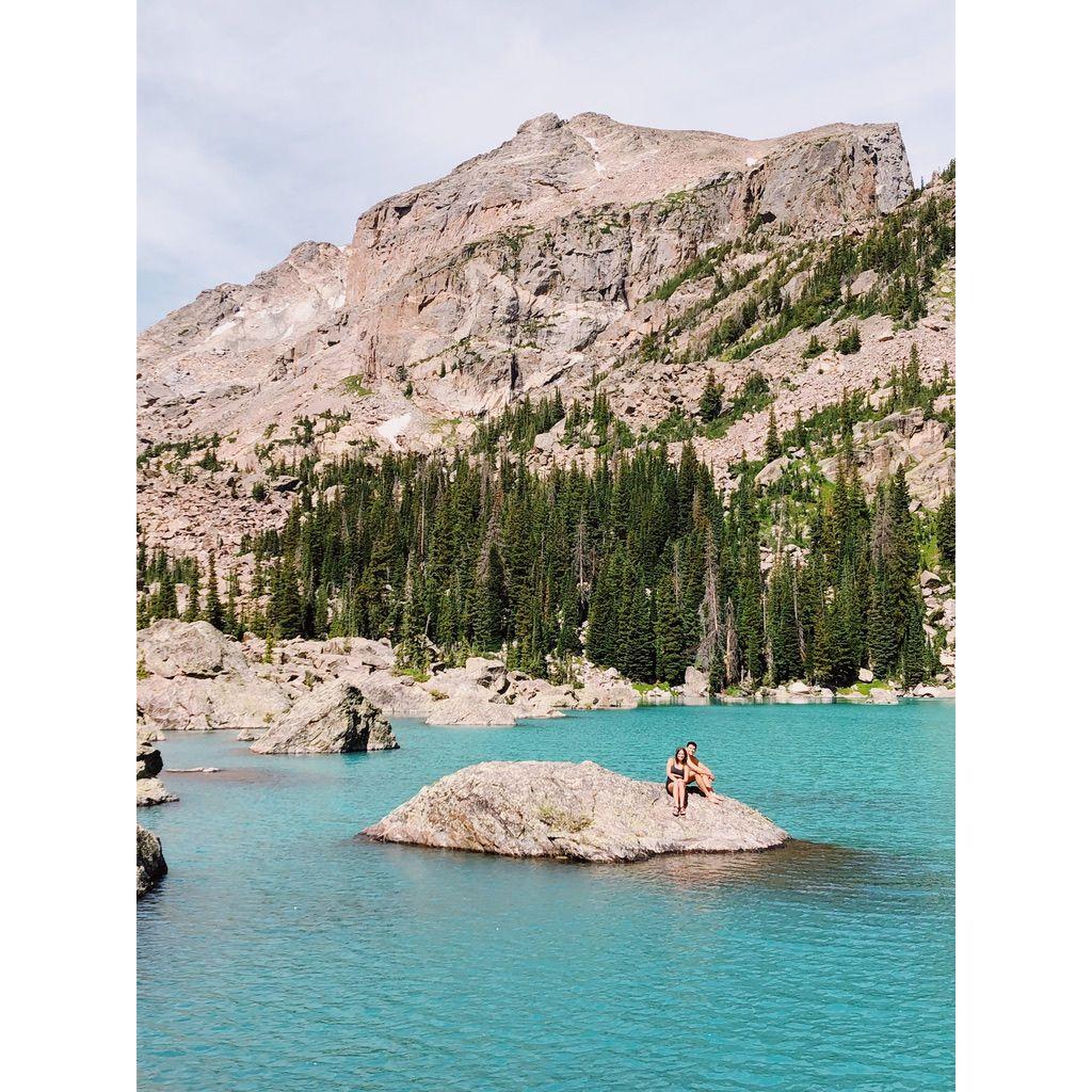 Elizabeth's 24th birthday. This kind lady from the shore snapped this picture of us after we swam to this rock in Rocky Mountain National Park.