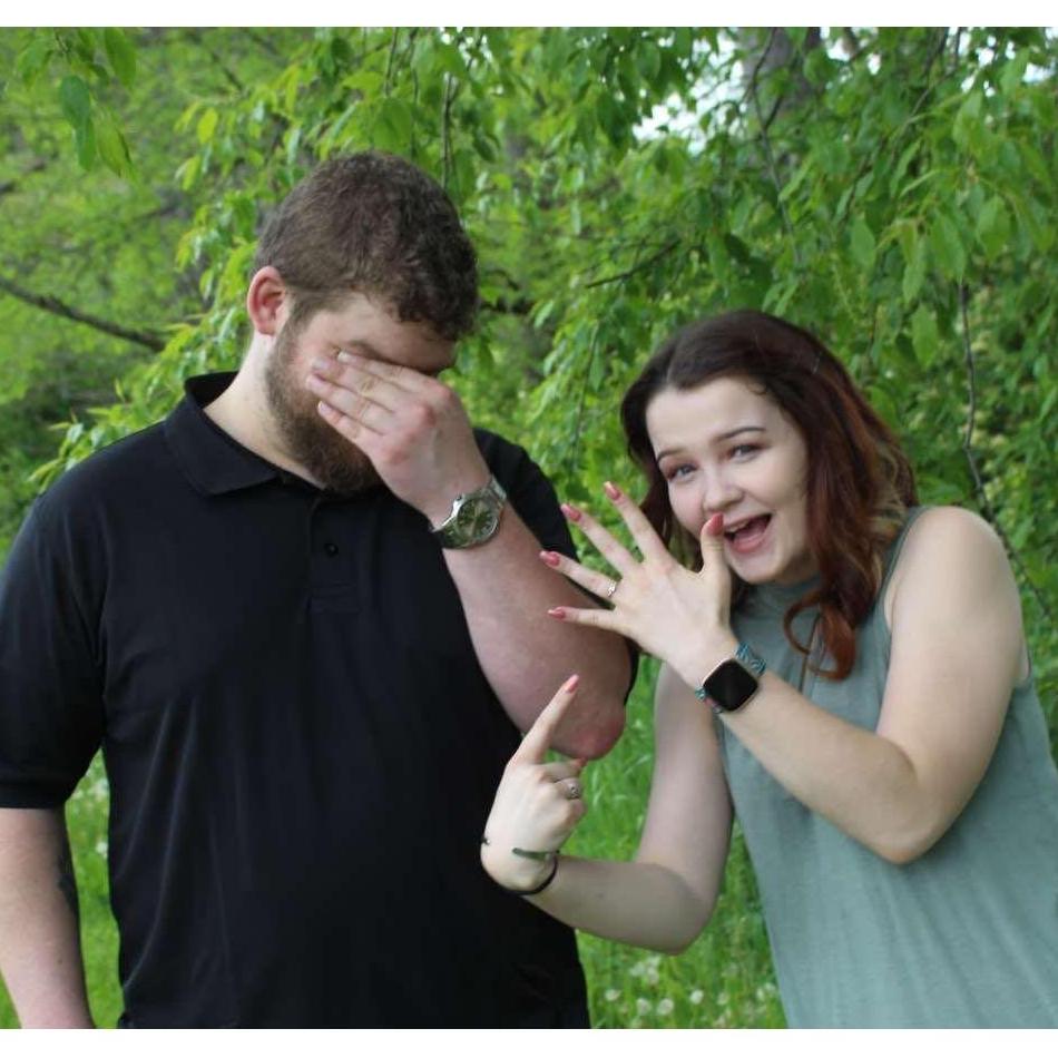 "I waited 4 years for this ring and I was excited when I finally got it. I had to show it off like this in a picture and my mom caught the perfect reaction from Nick.... PRICELESS!!!!"