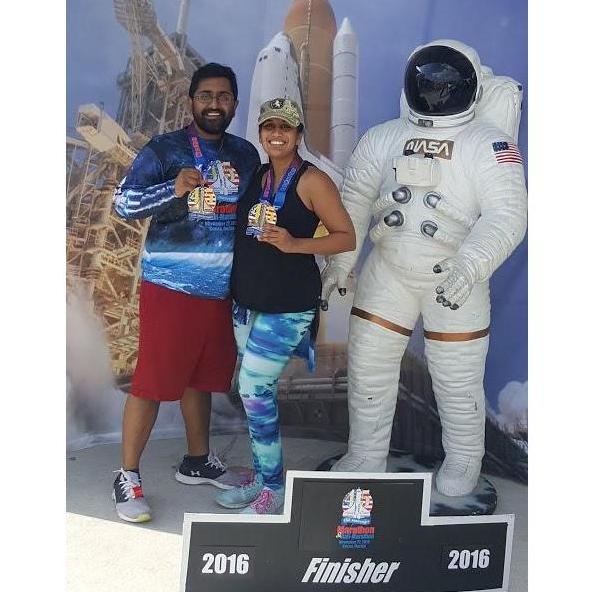We just ran 13.1 miles at the Space Coast Half Marathon. Our legs stopped working after taking this picure.