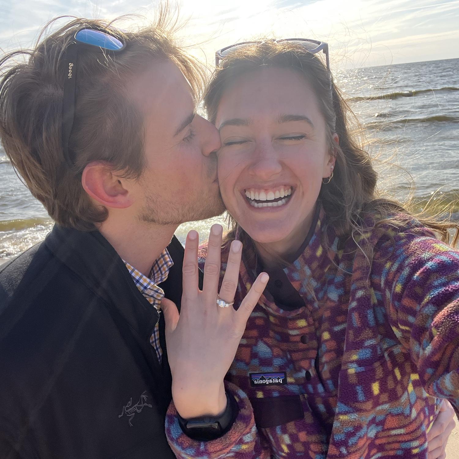 April 16, 2025: Engagement day! James proposes in Holland, MI on the beach in front of his family cottage. Both families are able to be there to celebrate that evening.