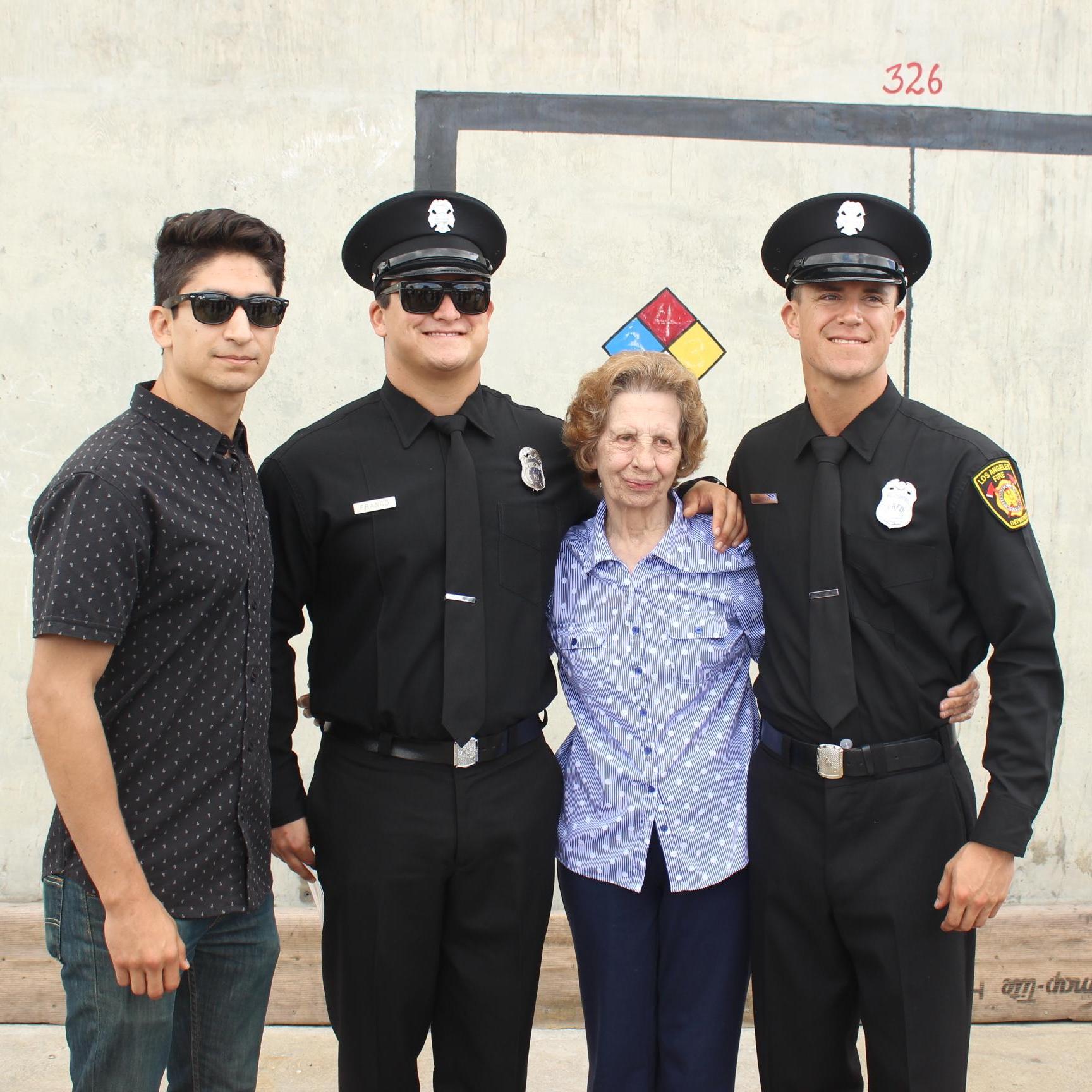 Ricky graduating the LAFD Fire Academy with his two best men and Nona.