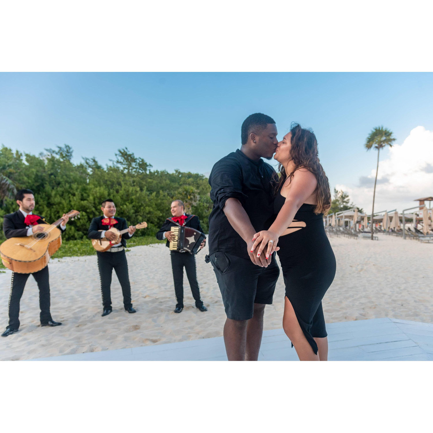 I said YES after Chris proposing with beautiful beach in the back and mariachis playing "Hermoso Cariño"