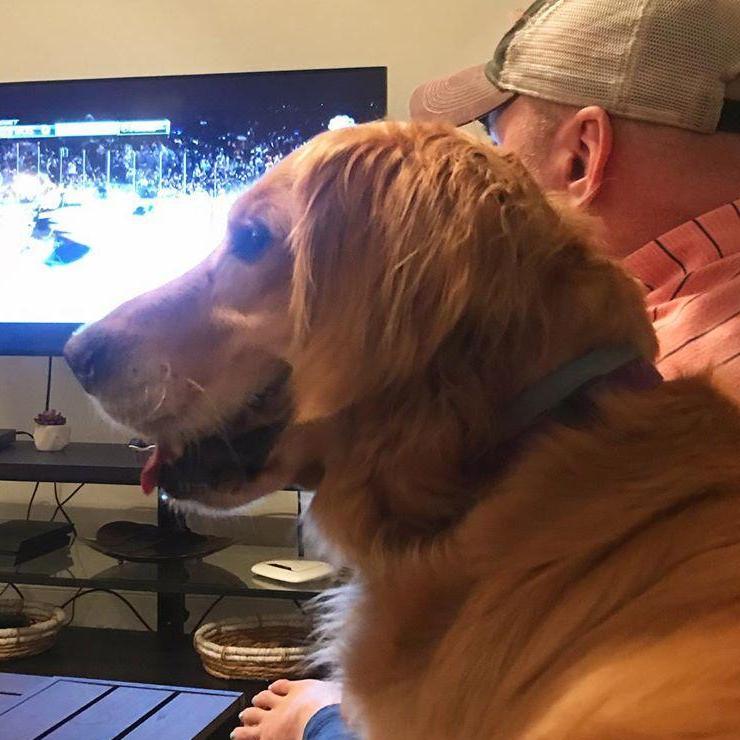 Making friends! Watching hockey with our new neighbors in Huntsville. Their dog had to be next to Shannon wherever he sat!