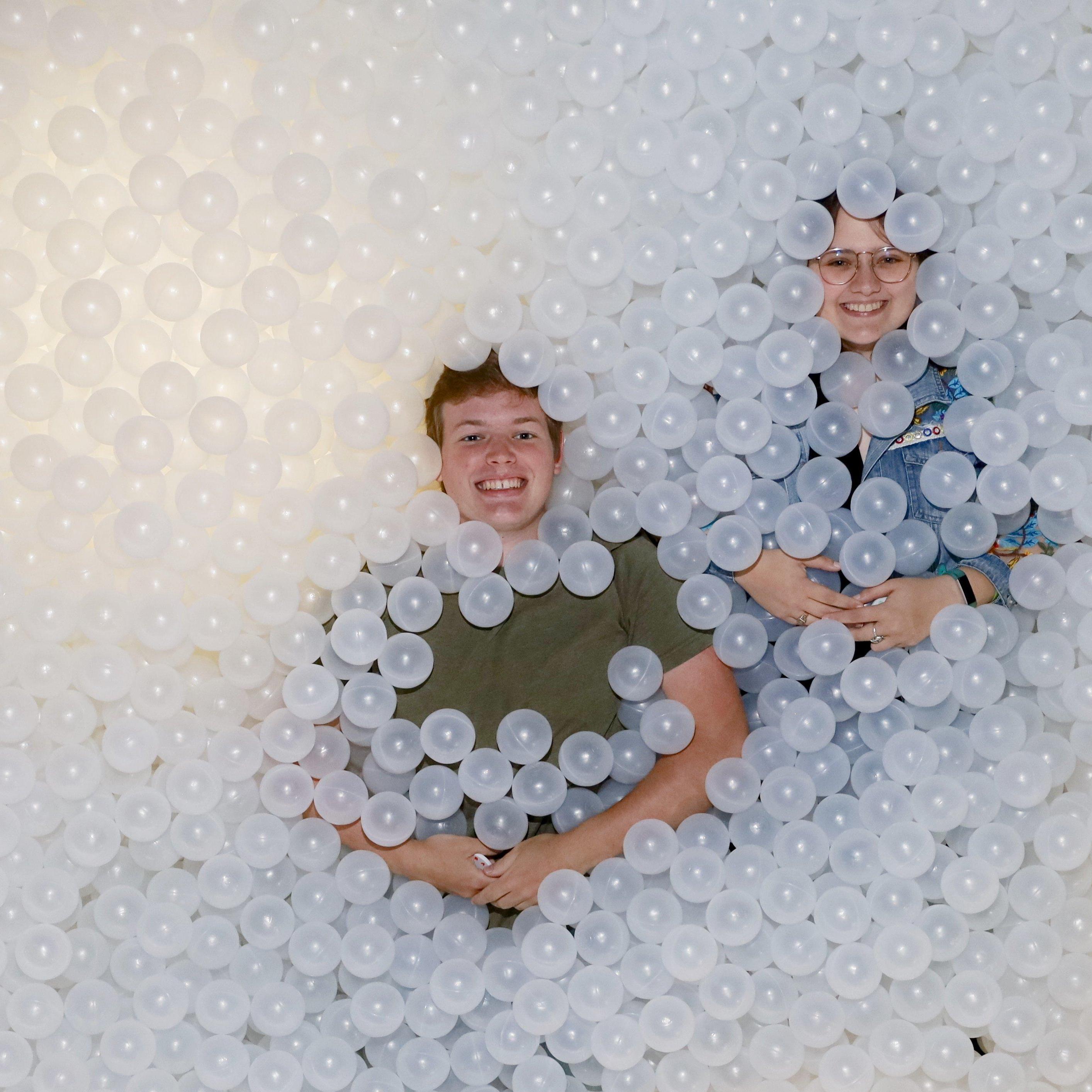 In a pit of love, and also balls.