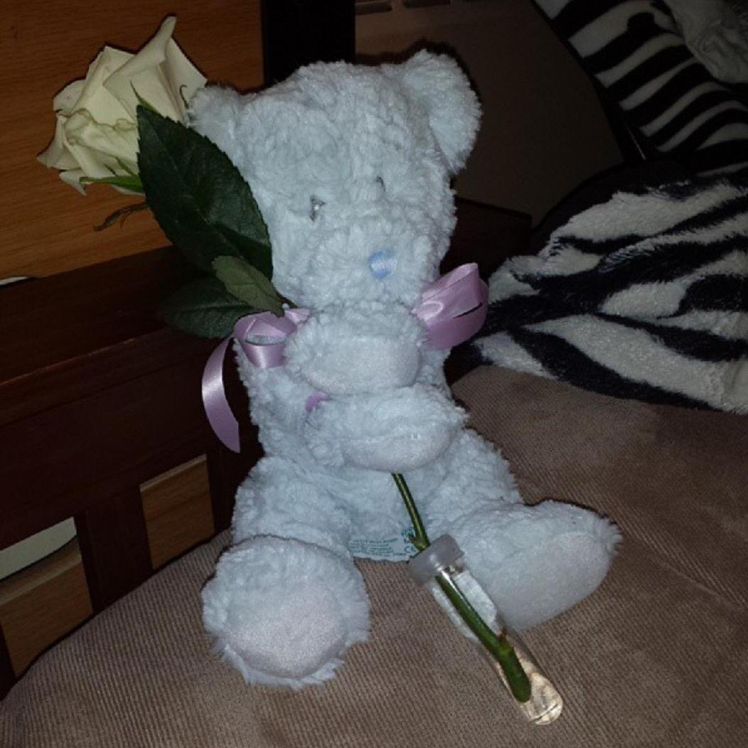 I once mentioned white roses as my favorite flower, so one of the first little gifts he got me was a stuffed bear with a white rose! We were freshman at MSU (no car) so he had to walk to the florist!