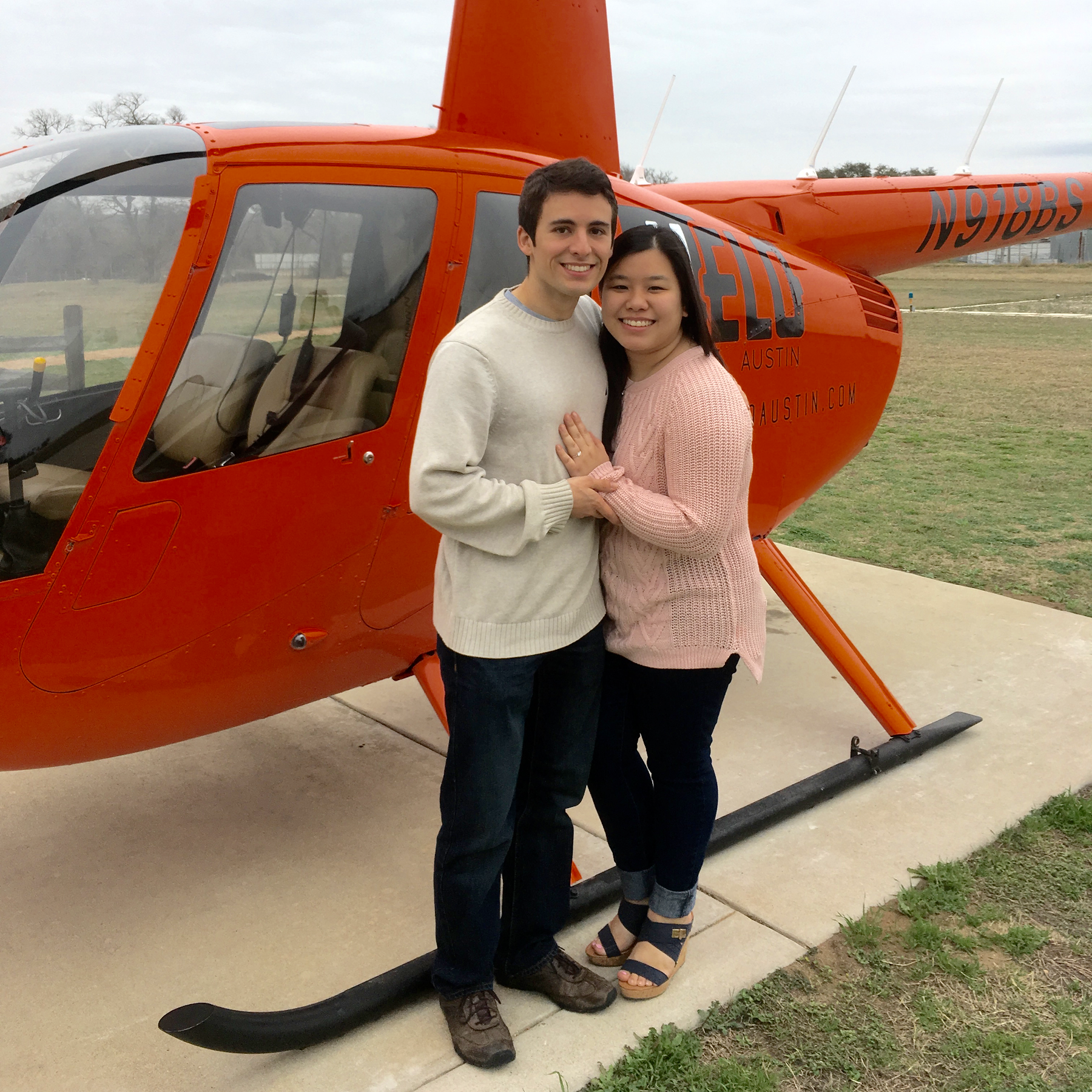 The newly engaged couple, after their helicopter tour of Austin