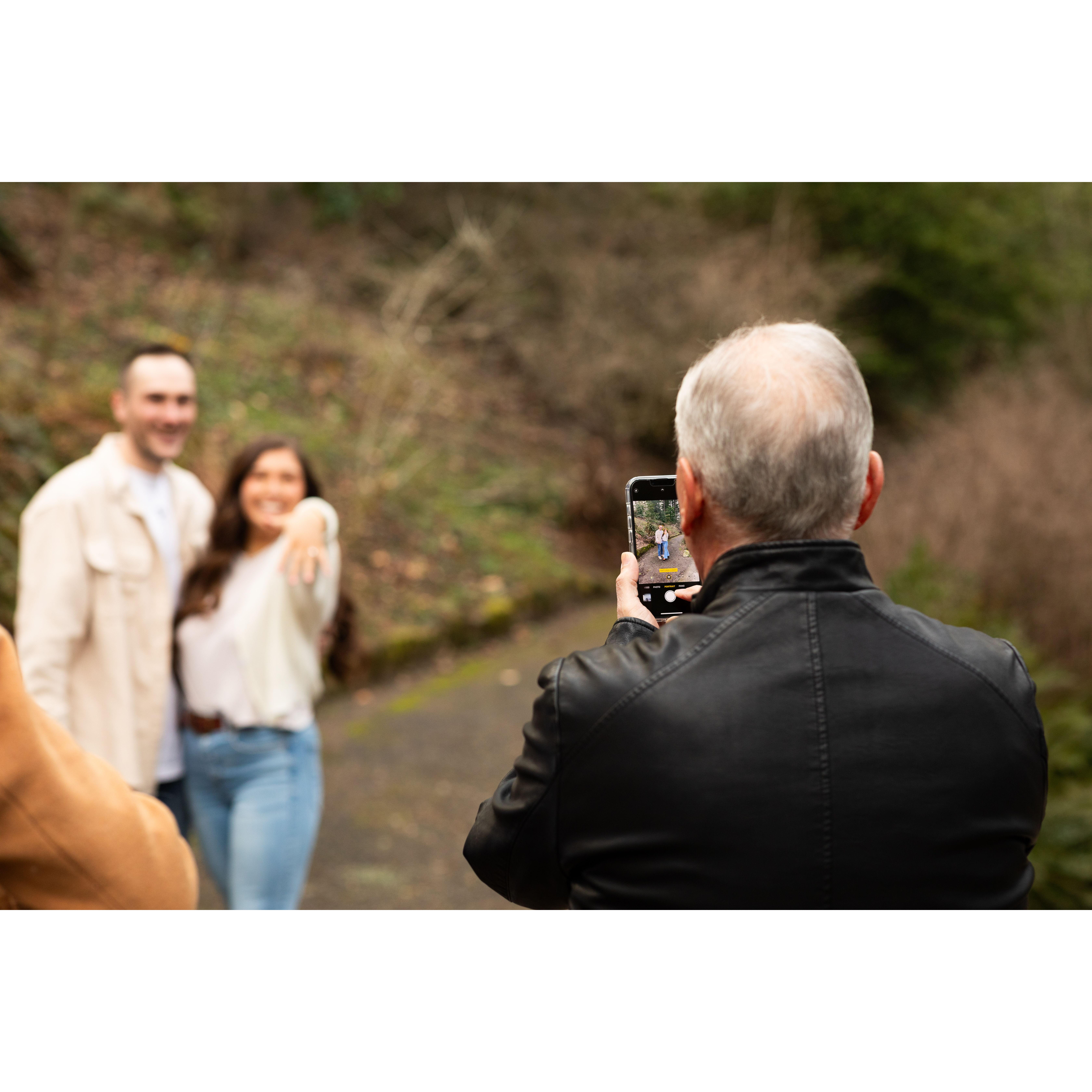 Such a special photo to us: Pete Avila taking the photo we used to announce our engagement.