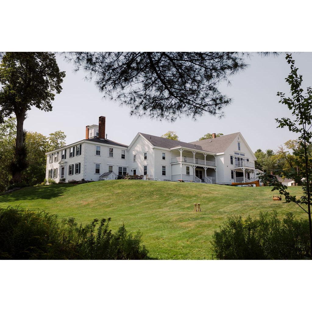 The 1774 Inn looking up from the lower grounds along the Kennebec River.