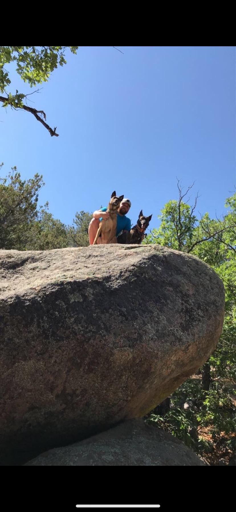 Lucas with the Malinois, Lina & Eva.