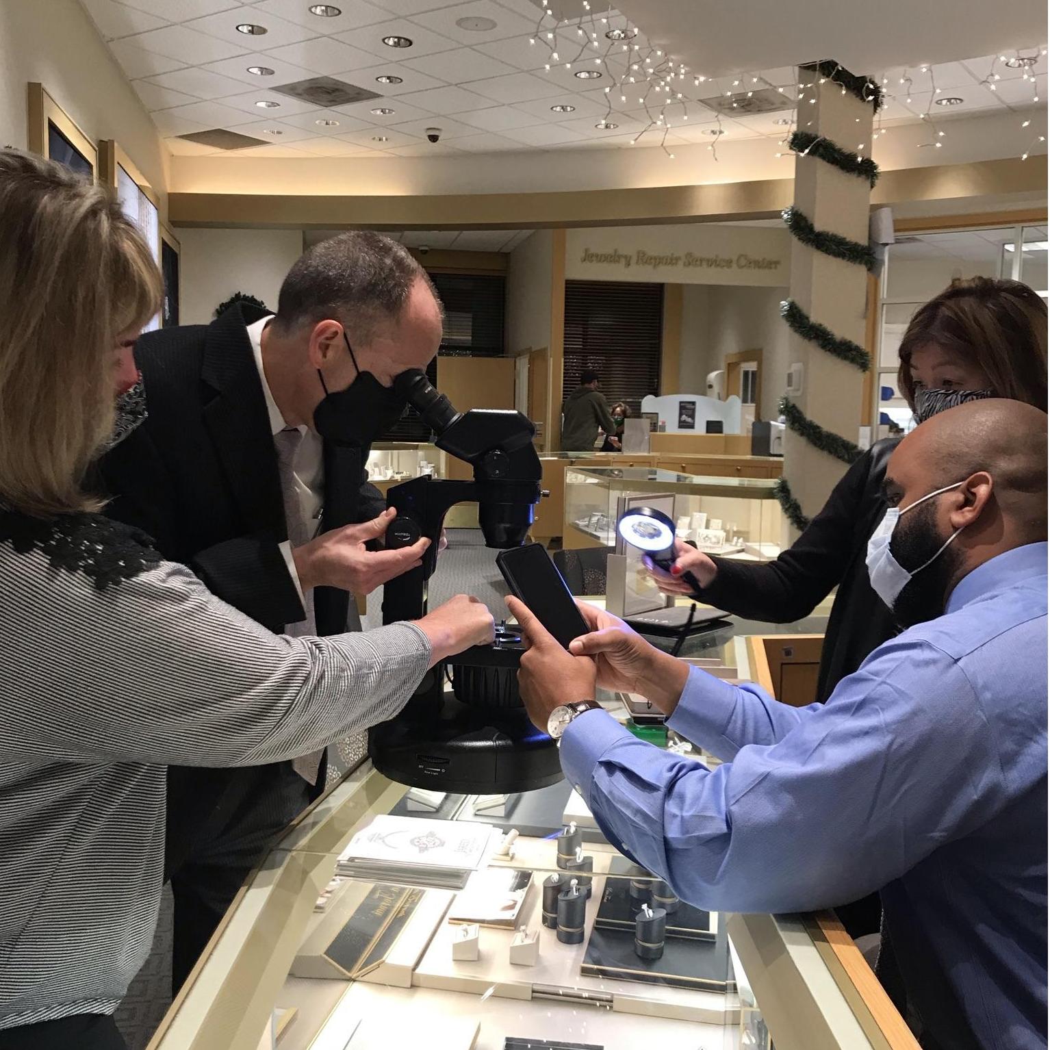 Inspecting my diamond and trying to read the serial number on the diamond