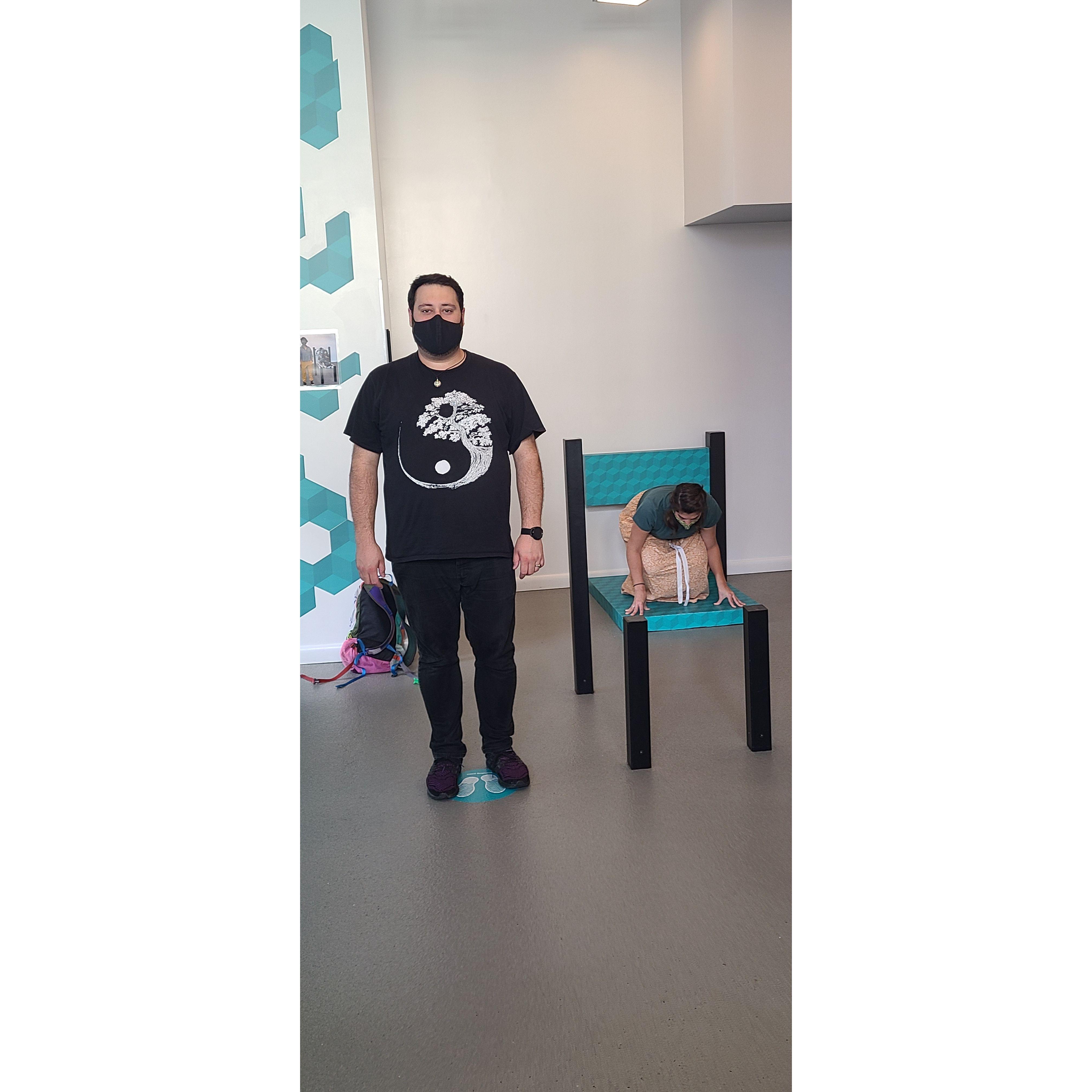 Museum of Illusions. No Casey is not a miniature on a normal sized chair. Your brain has deceived you! With the power of ILLUSION!