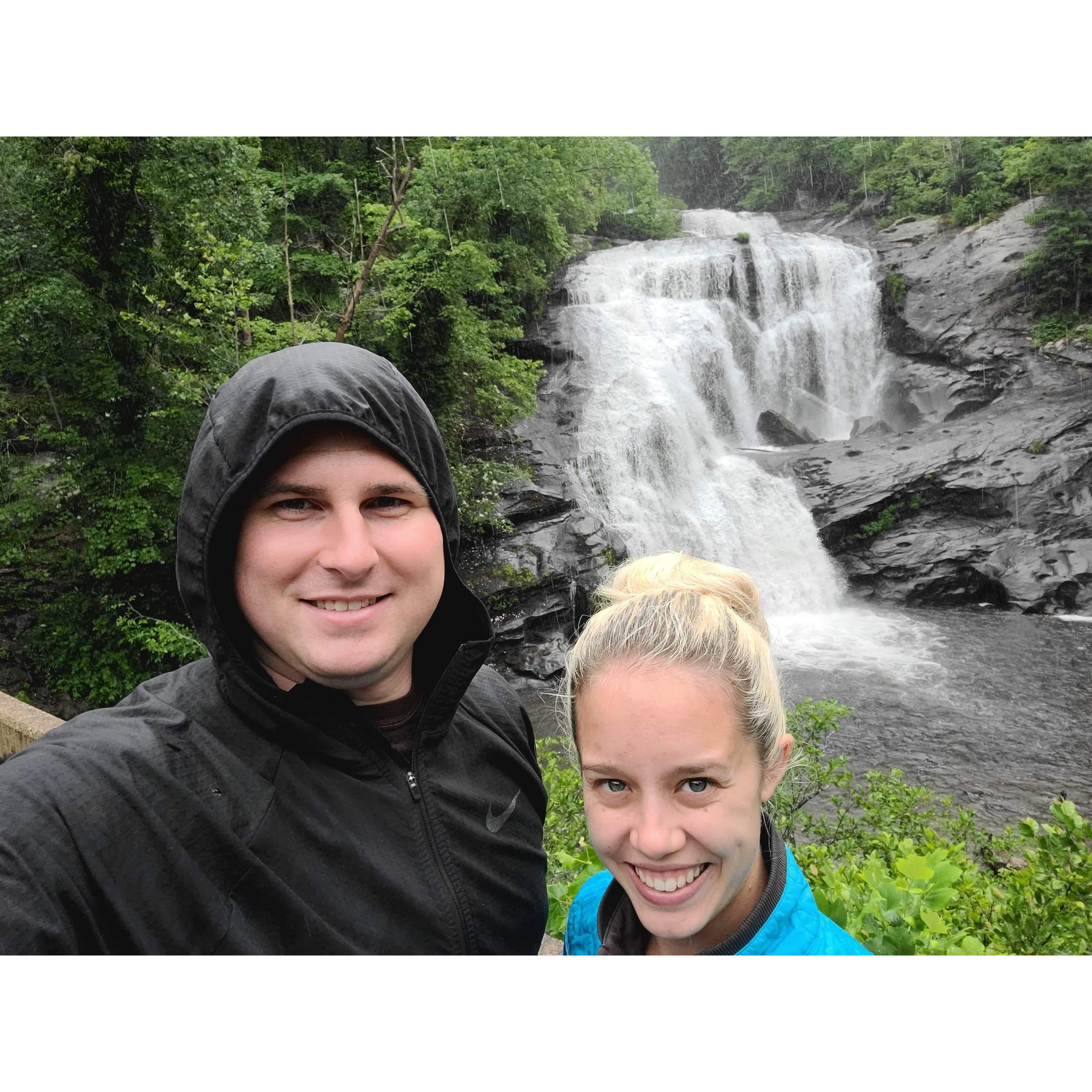Hiking in the rain in NC to see waterfalls.