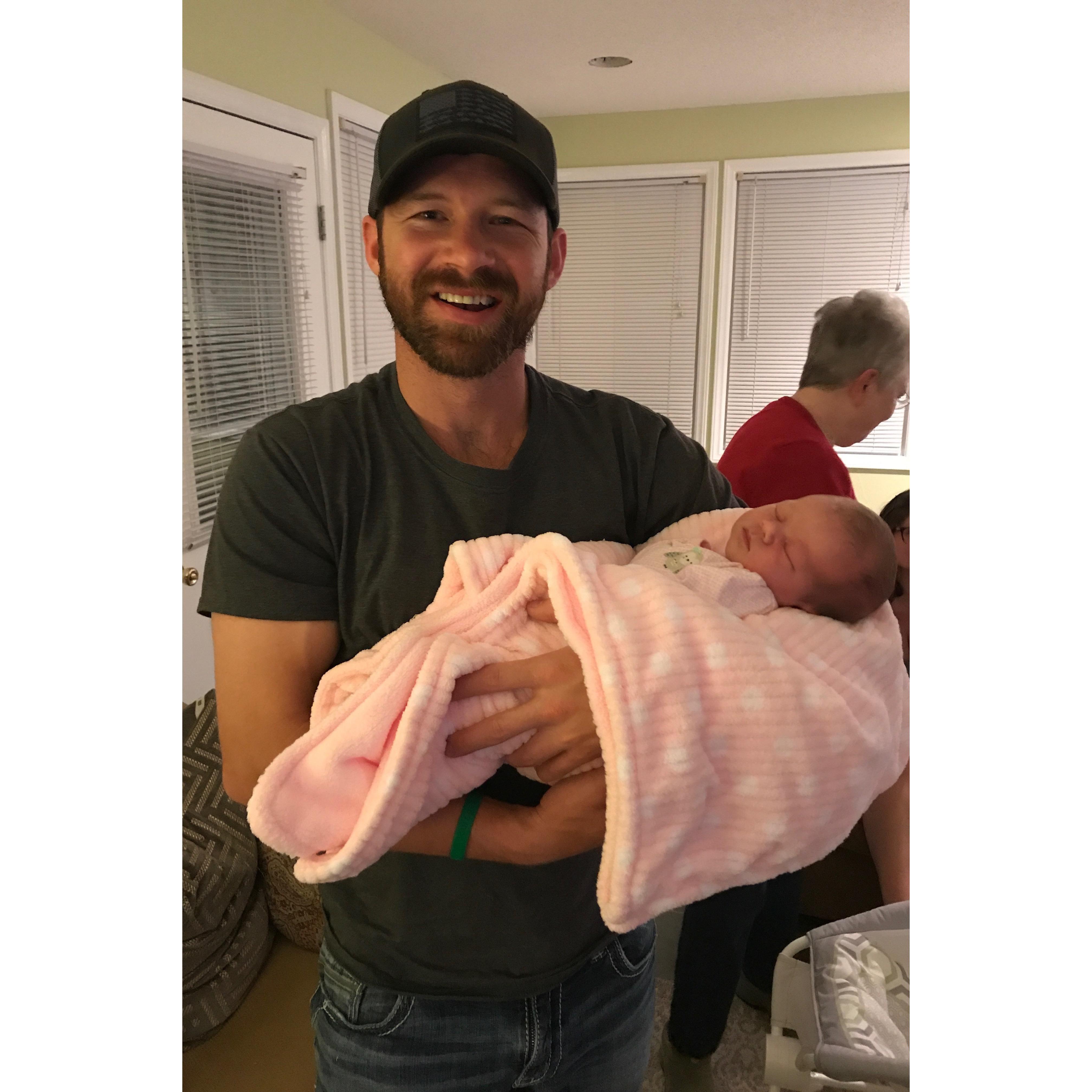 Casey meeting our oldest niece and flower girl, Ella. 2018