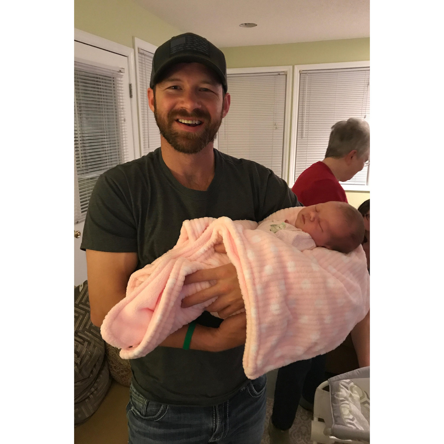 Casey meeting our oldest niece and flower girl, Ella. 2018