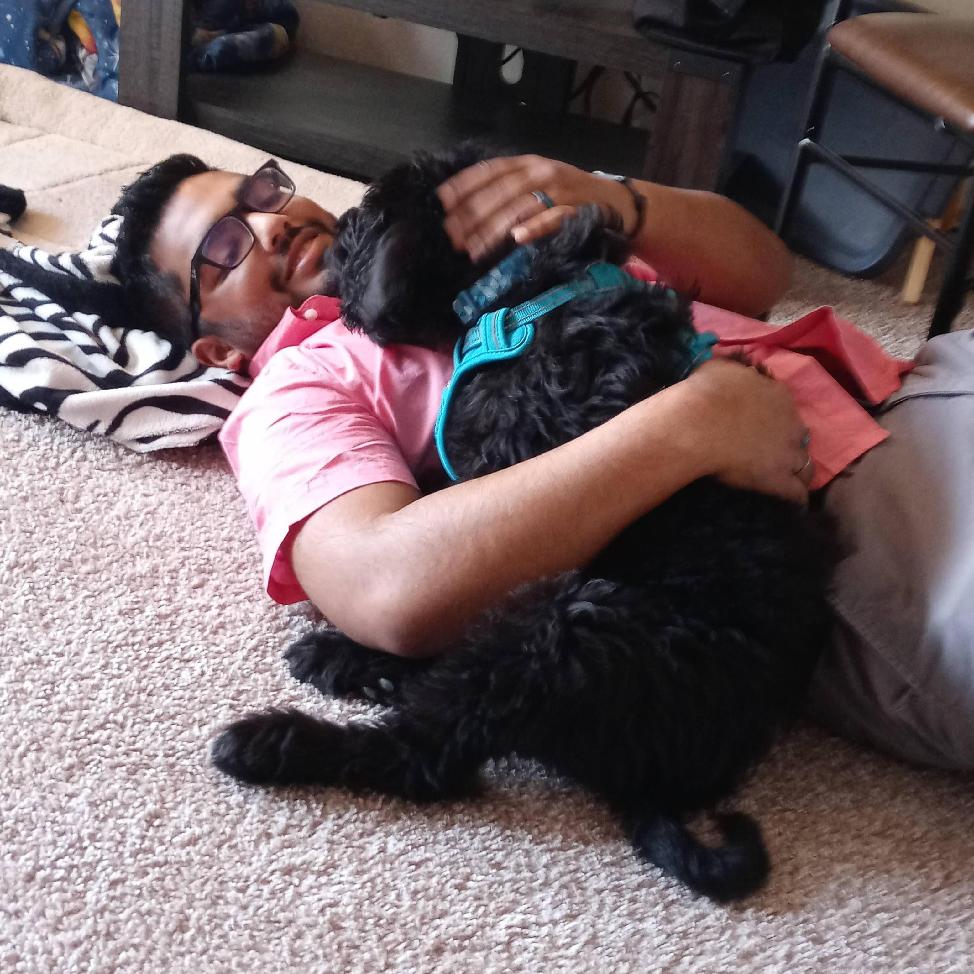 Sami and Josh got a new puppy! Shadow is a Labradoodle and keeps them on their toes. Especially when he's trying to bite their toes.