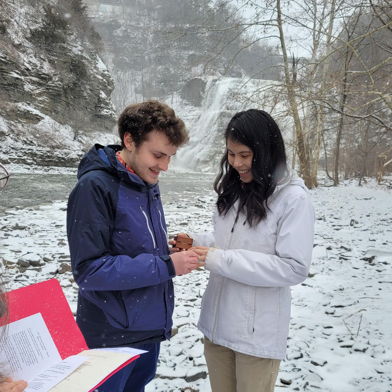 David putting ring on Katherine during their civil ceremony.