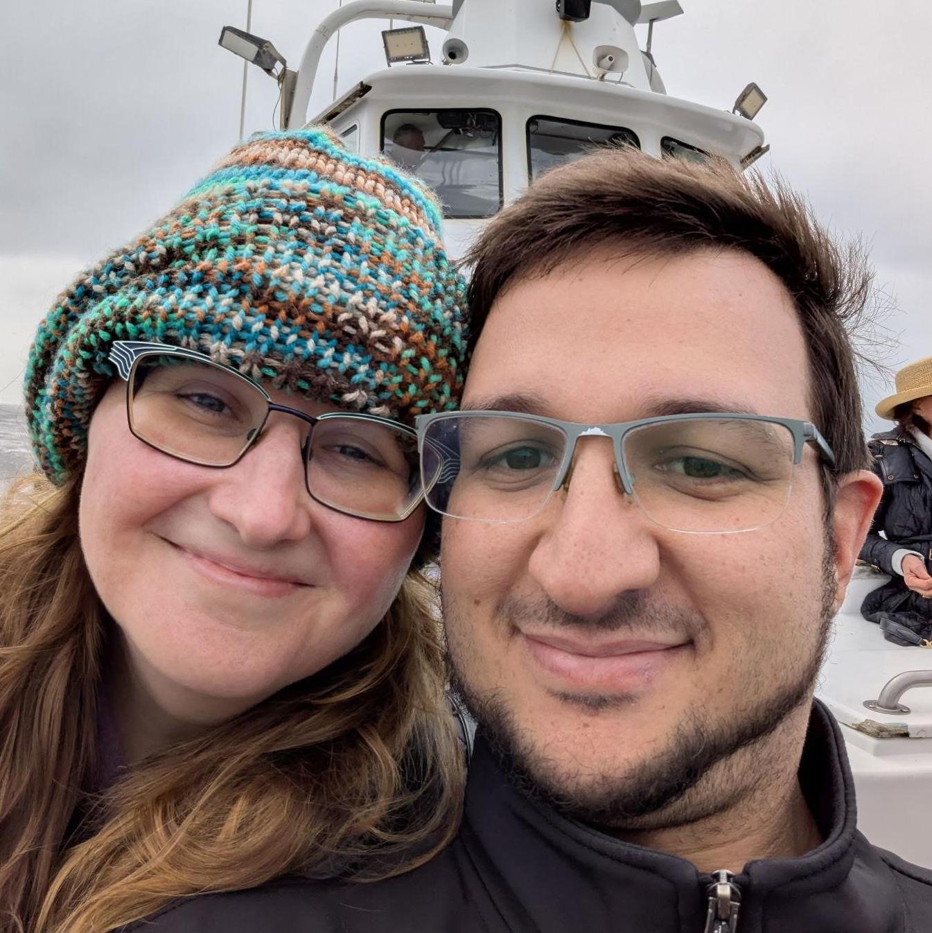 A seafaring couple scouting marine wildlife near home.