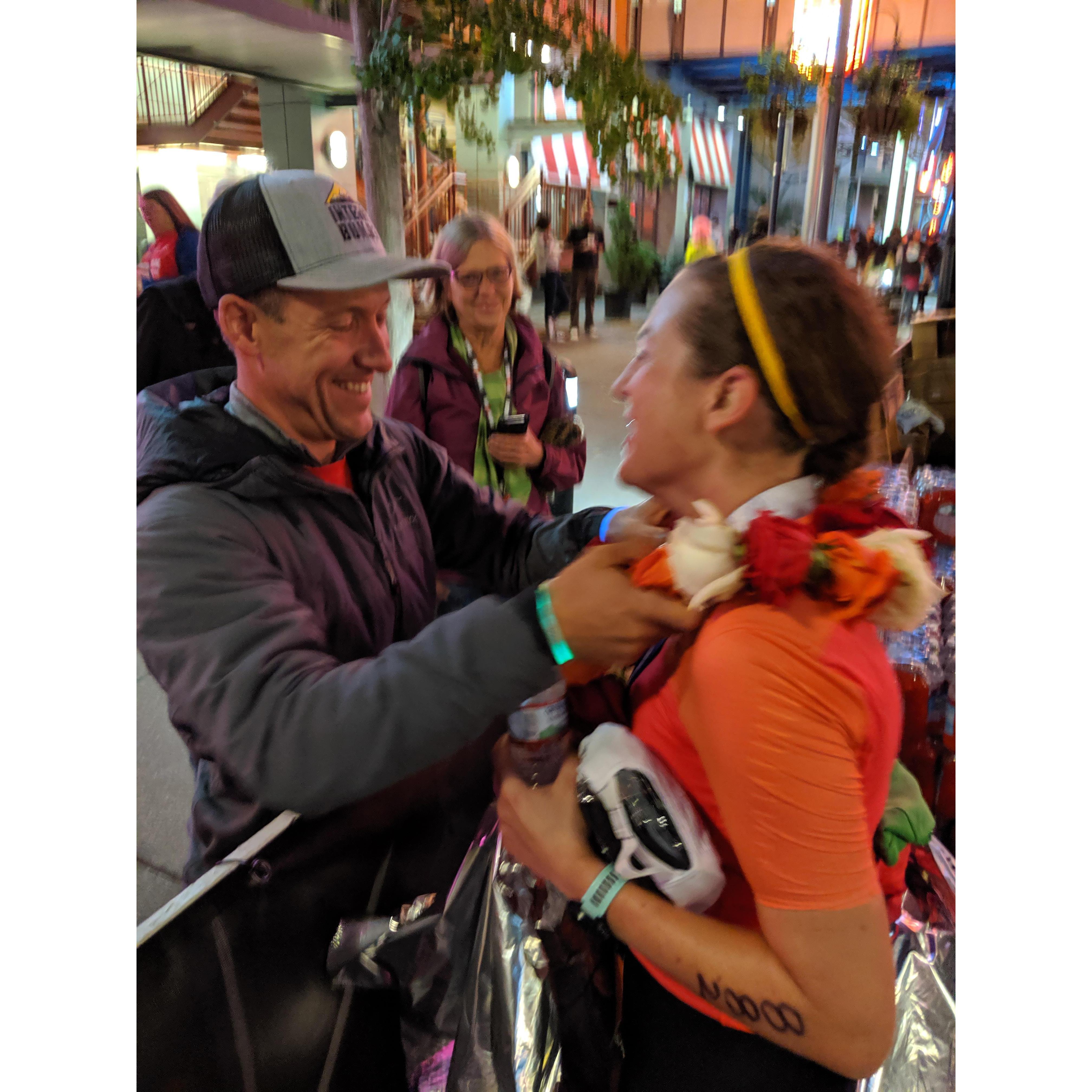 Keith at the finish line of Courtney's Ironman