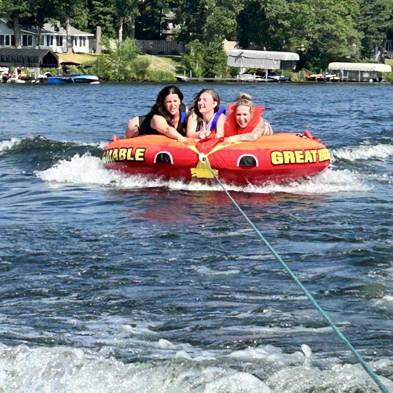 The girls and I fighting for our lives while the boys whip us around on the tube!