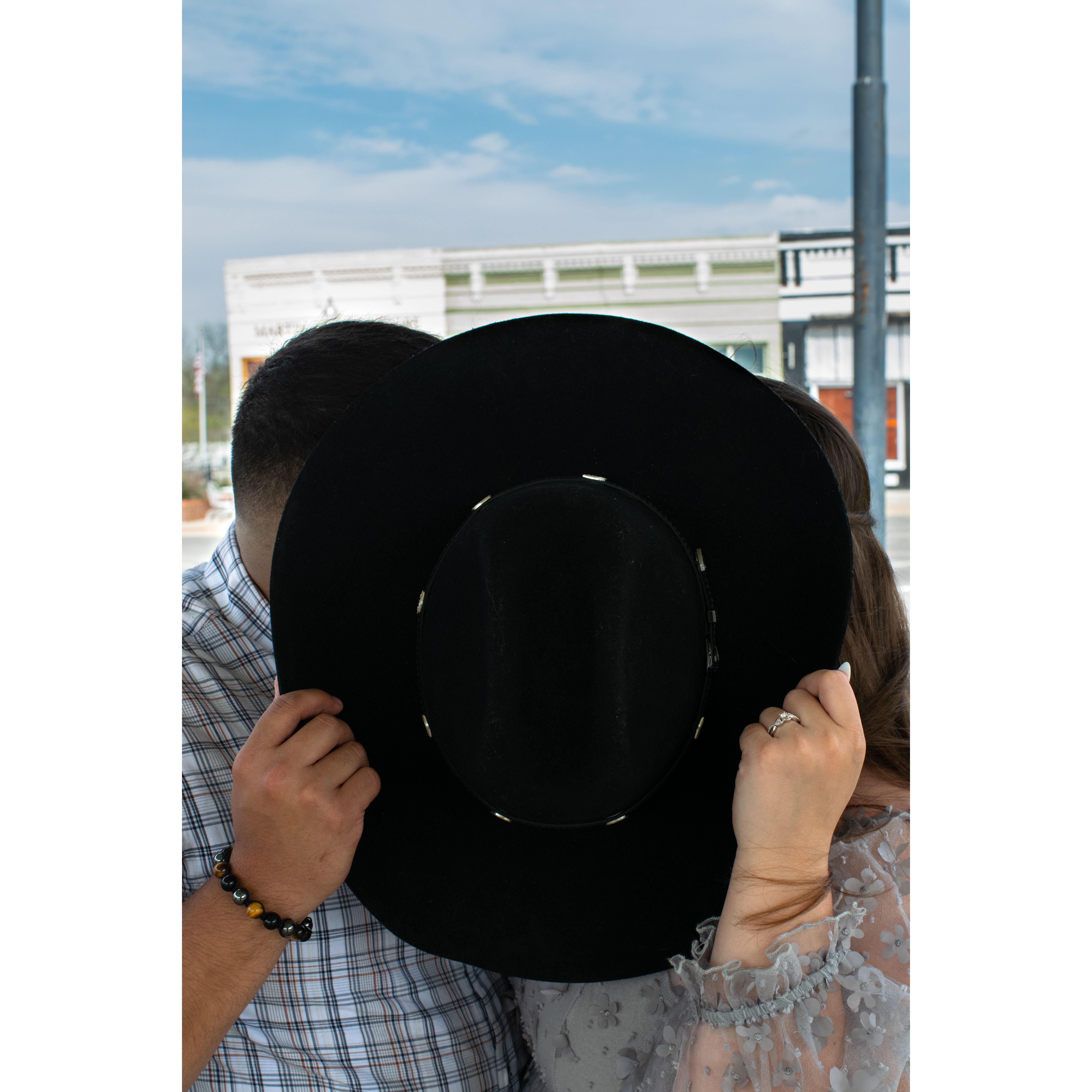 Engagement Picture! We're holding Pedro's hat—a picture taken by Ryan Hooper.