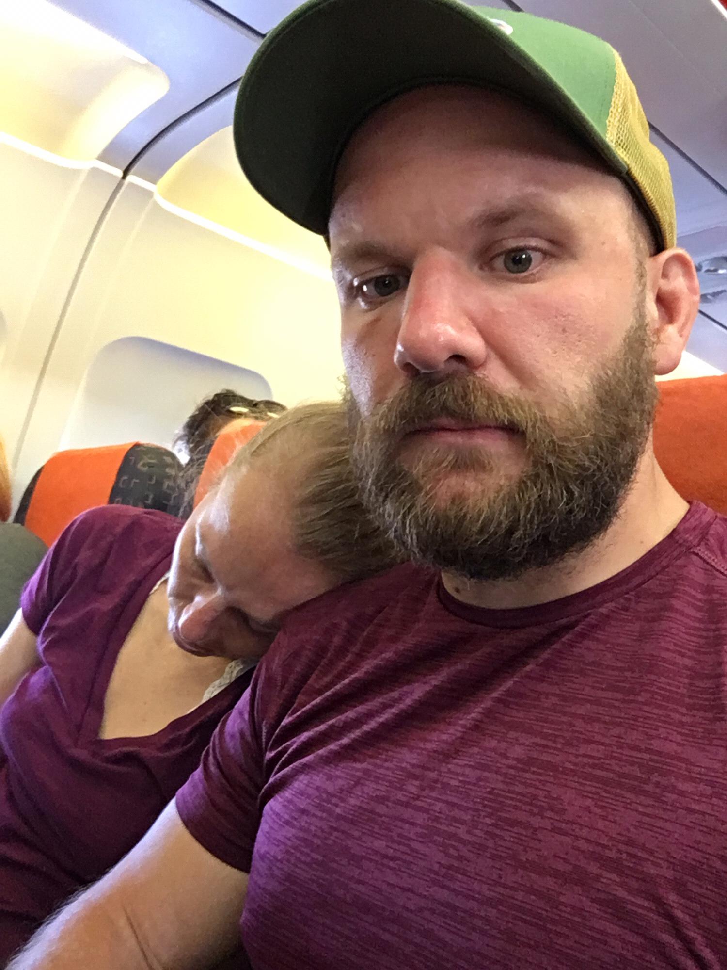 Sleeping on the plane after Amy’s wedding