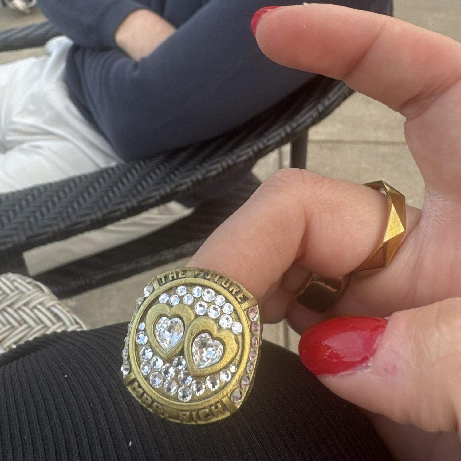 The ring not being ready due to quality concern Doug had one of his friends make a championship replica ring and proposed with it.