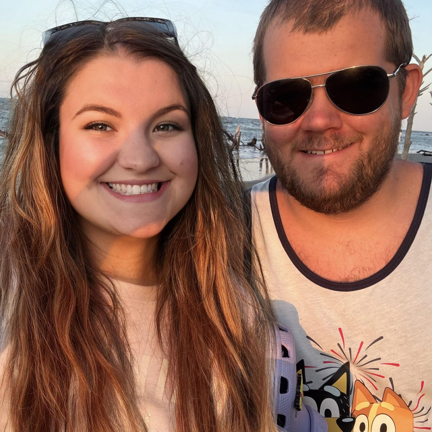 One of our favorite photos of us at our favorite beach.... Folly Beach lighthouse spot