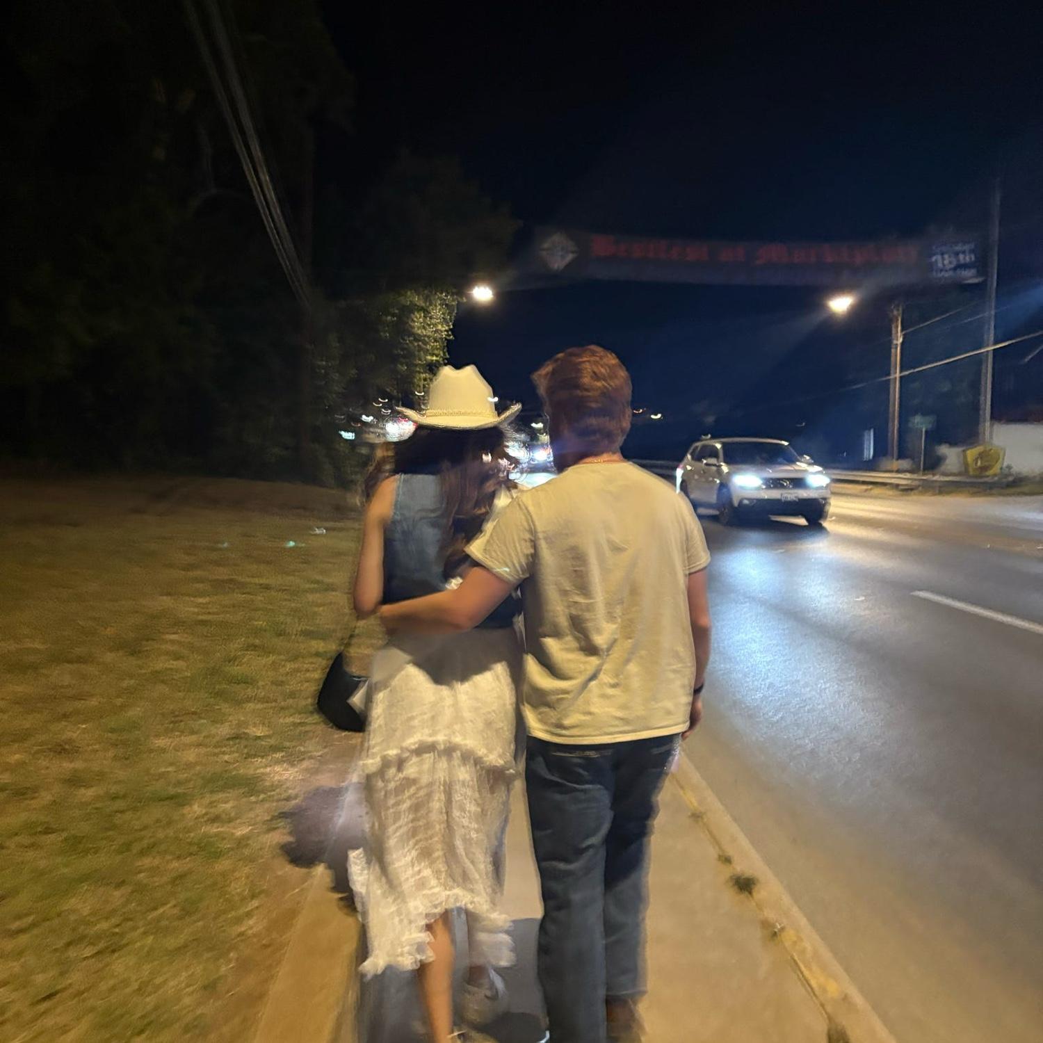 10/18/25. The couple walking in Fredericksburg, TX during their joint bach weekend!